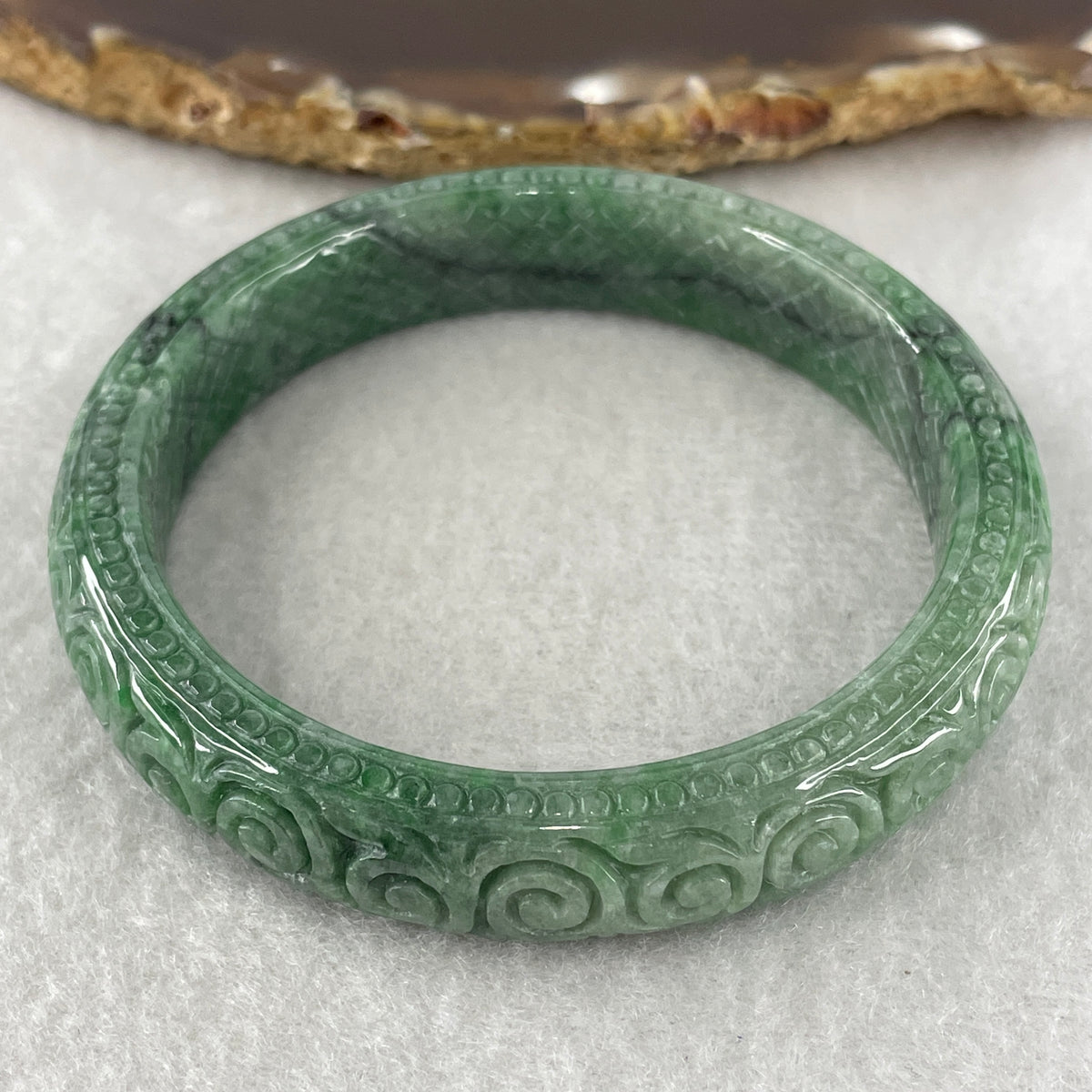 Natural Type Green Jadeite Prosperity Flowers Bangle 46.28g Inner Diameter 55.6mm 12.1 by 8.2mm (External Line) - Huangs Jadeite and Jewelry Pte Ltd