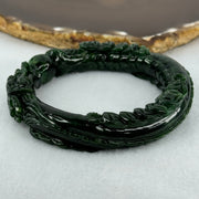 Type A Translucent to Opaque Old Mine Spicy Green Jadeite Dragon Bangle Internal Diameter 56.30mm 374.20cts 74.75g 16.0 by 12.5mm With NGI Cert 32885979 (Slight Internal Lines) - Huangs Jadeite and Jewelry Pte Ltd
