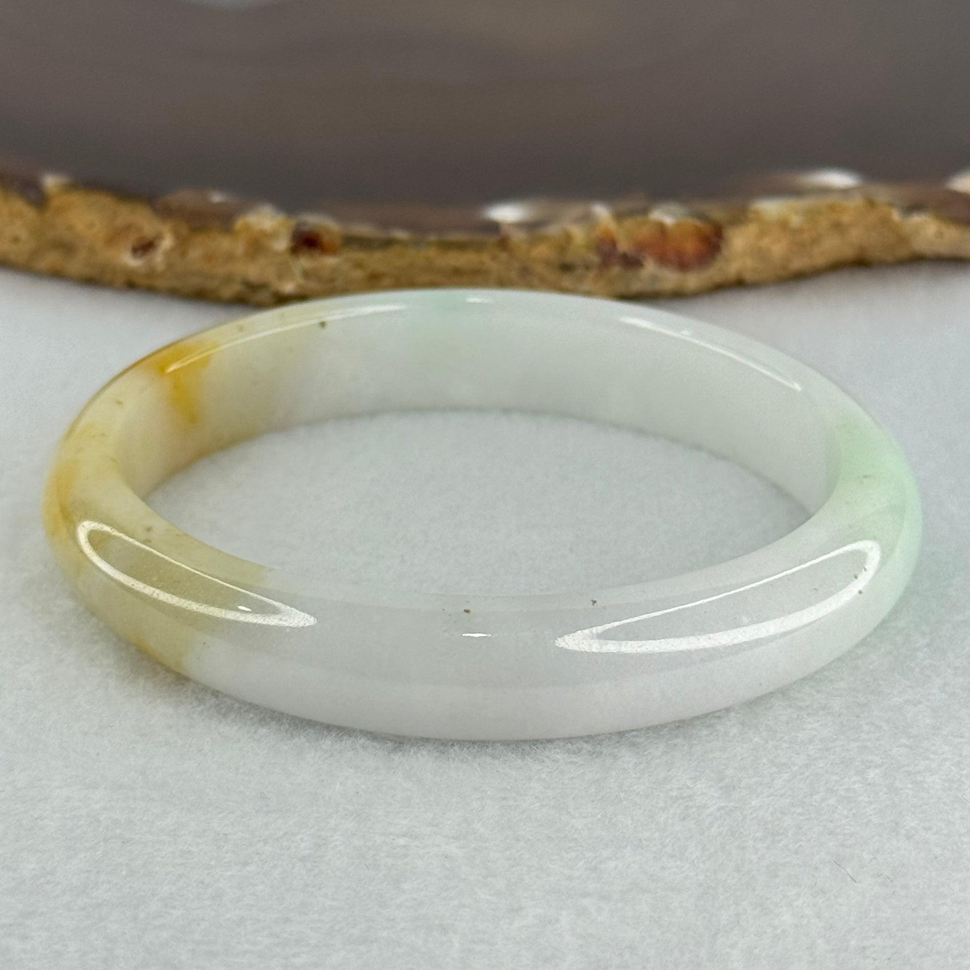 Type A Faint Lavender Green with Yellow Patches Jadeite Oval Bangle Internal Diameter 56.5mm  37.8696g 11.1 by 7.3mm (Very Slight Internal Line) - Huangs Jadeite and Jewelry Pte Ltd