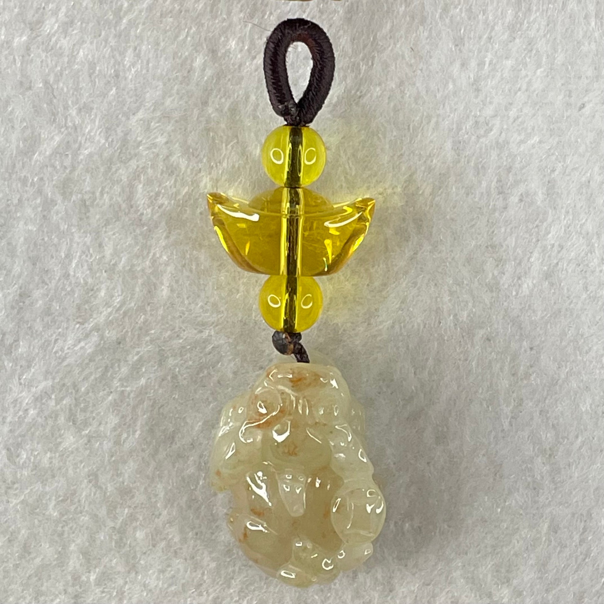 Type A Faint Yellow with Reddish Brown Spots Jadeite Male Pixiu Charm 8.27g 22.5 by 16 by 12.2mm - Huangs Jadeite and Jewelry Pte Ltd