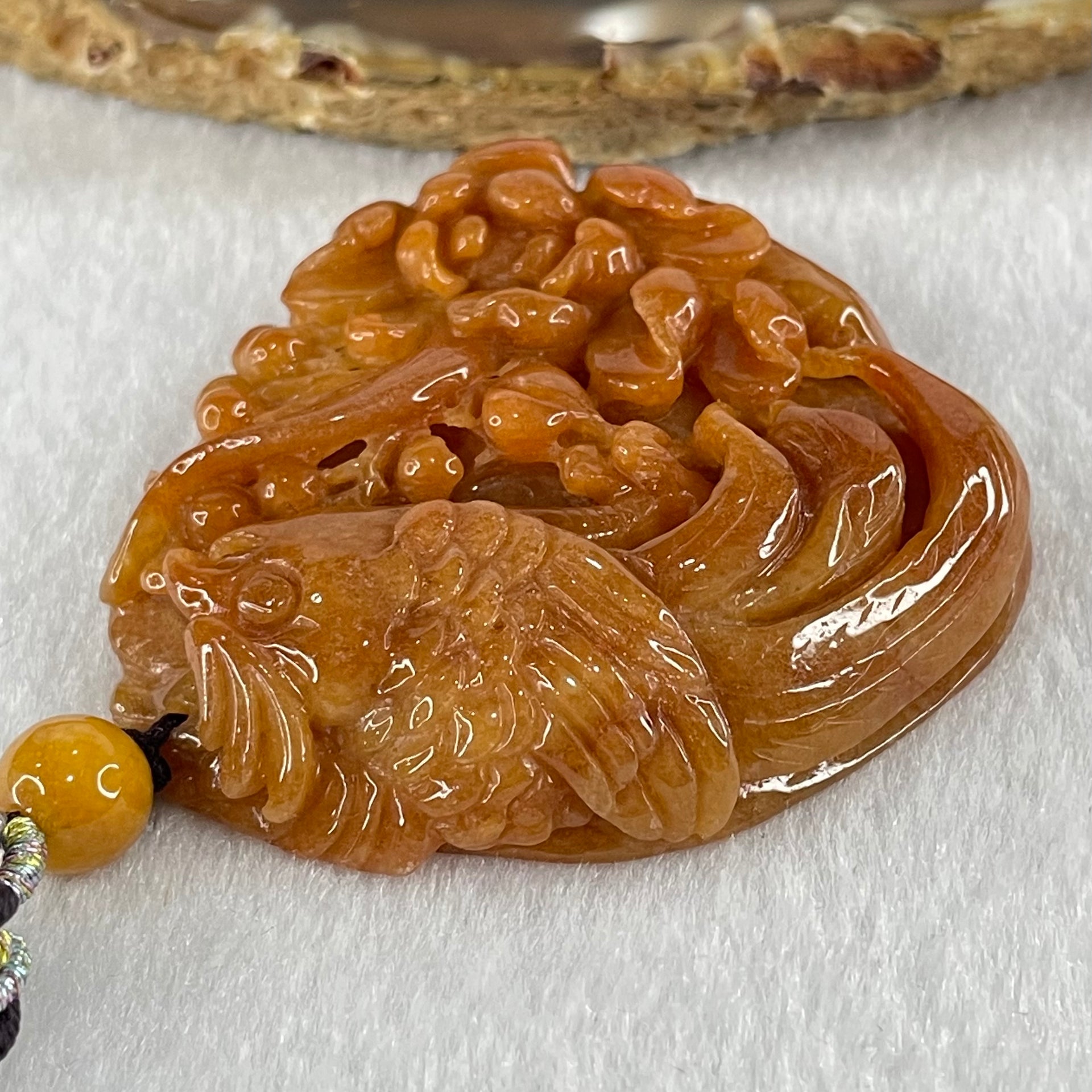 Grandmaster Type A Translucent Brownish Orange to Brownish Red with Light Blueish Green Jadeite Bird with Flower 花开富贵 Pendant 53.67g 49.27 by 46.37 by 12.66mm With NGI Cert 82838746 - Huangs Jadeite and Jewelry Pte Ltd