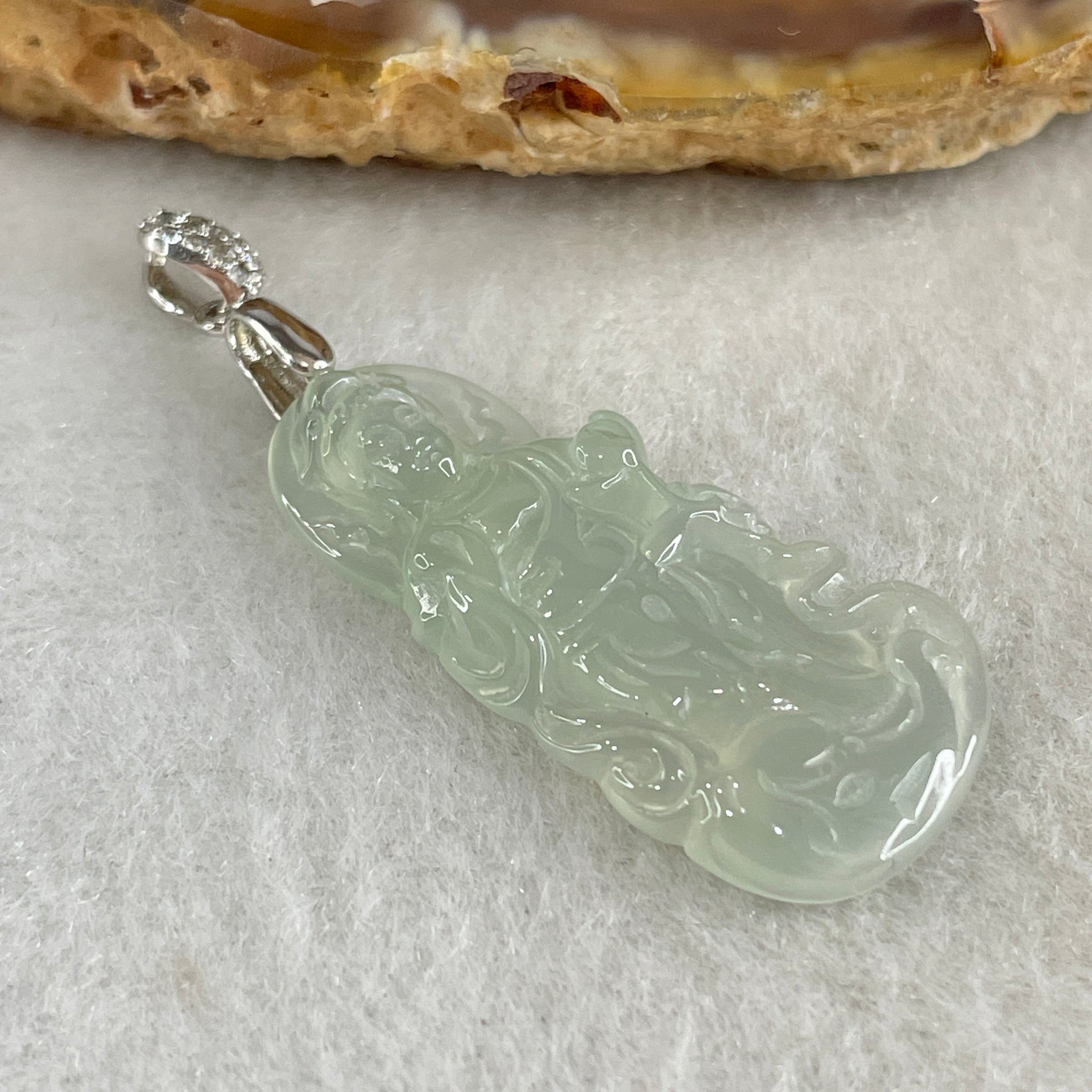 Type A Icy Colourless to Faint Green Jadeite Guan Yin Pendant 3.0g 31.0 by 14.5 by 3.5mm - Huangs Jadeite and Jewelry Pte Ltd