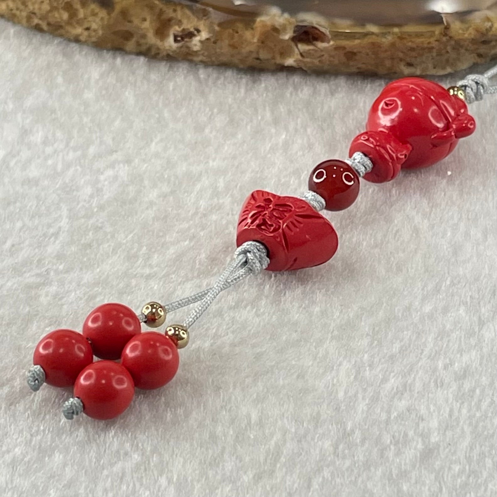 Natural Red Cinnabar Baby God of Fortune 16.0 by 16.8 by 11.3mm with Ingot Yuan Bao 9.0 by 13.06 by 9.1mm and Beads 6.54g - Huangs Jadeite and Jewelry Pte Ltd