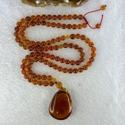 Natural Cognac Amber Ruyi Pendent 37.7 by 27.0 by 12.2mm in Amber Beads Necklace 6.3mm 105 Beads Total 19.80g - Huangs Jadeite and Jewelry Pte Ltd