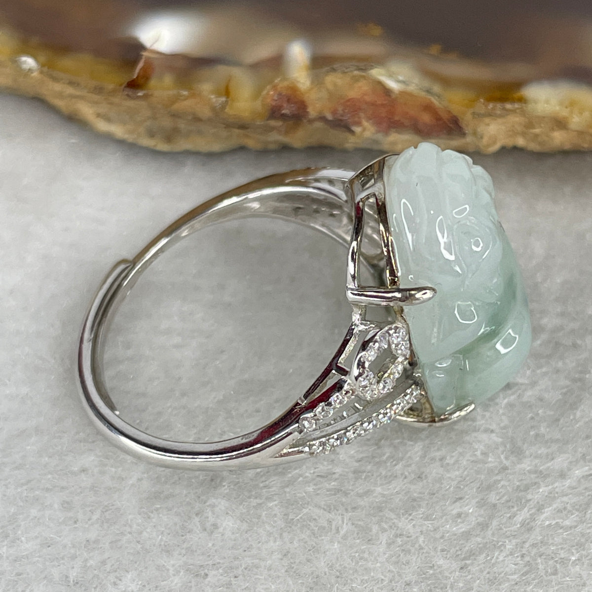Type A White Jadeite Ring | Ethereal Floating Blueish-Green Flora (Piao Hua) | Master Hand-Carved Prosperity Pixiu | Solid S925 Sterling Silver Setting | Smart Adjustable Sizing (4.77g 18.5x12.7x6.5mm) - Huangs Jadeite and Jewelry Pte Ltd