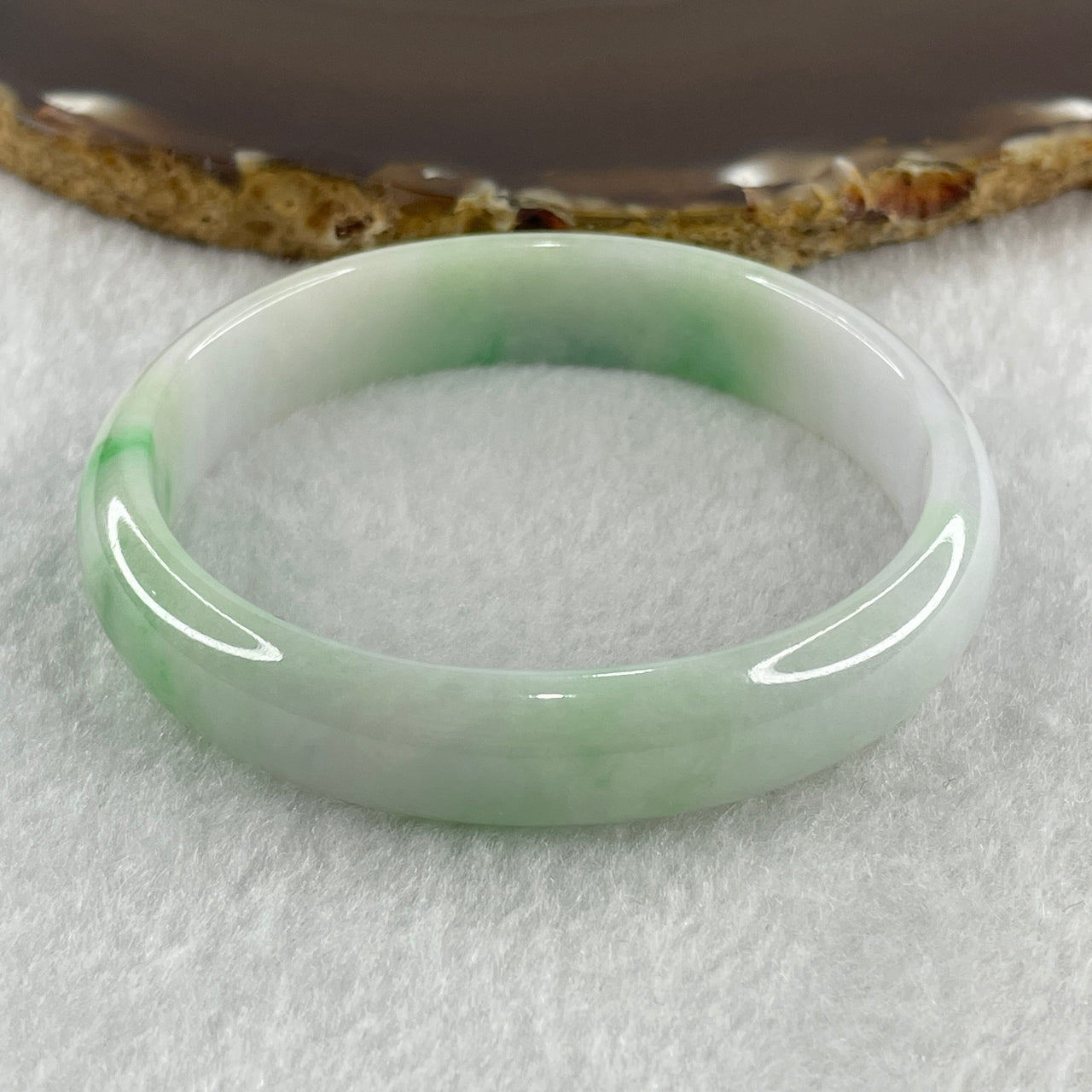 Certified Natural Type A Faint Lavender with Emerald Green Patches Jadeite Oval Bangle 32.89g Inner Diameter 55.4mm Thickness 12.2 by 5.7mm (Slight External Line)