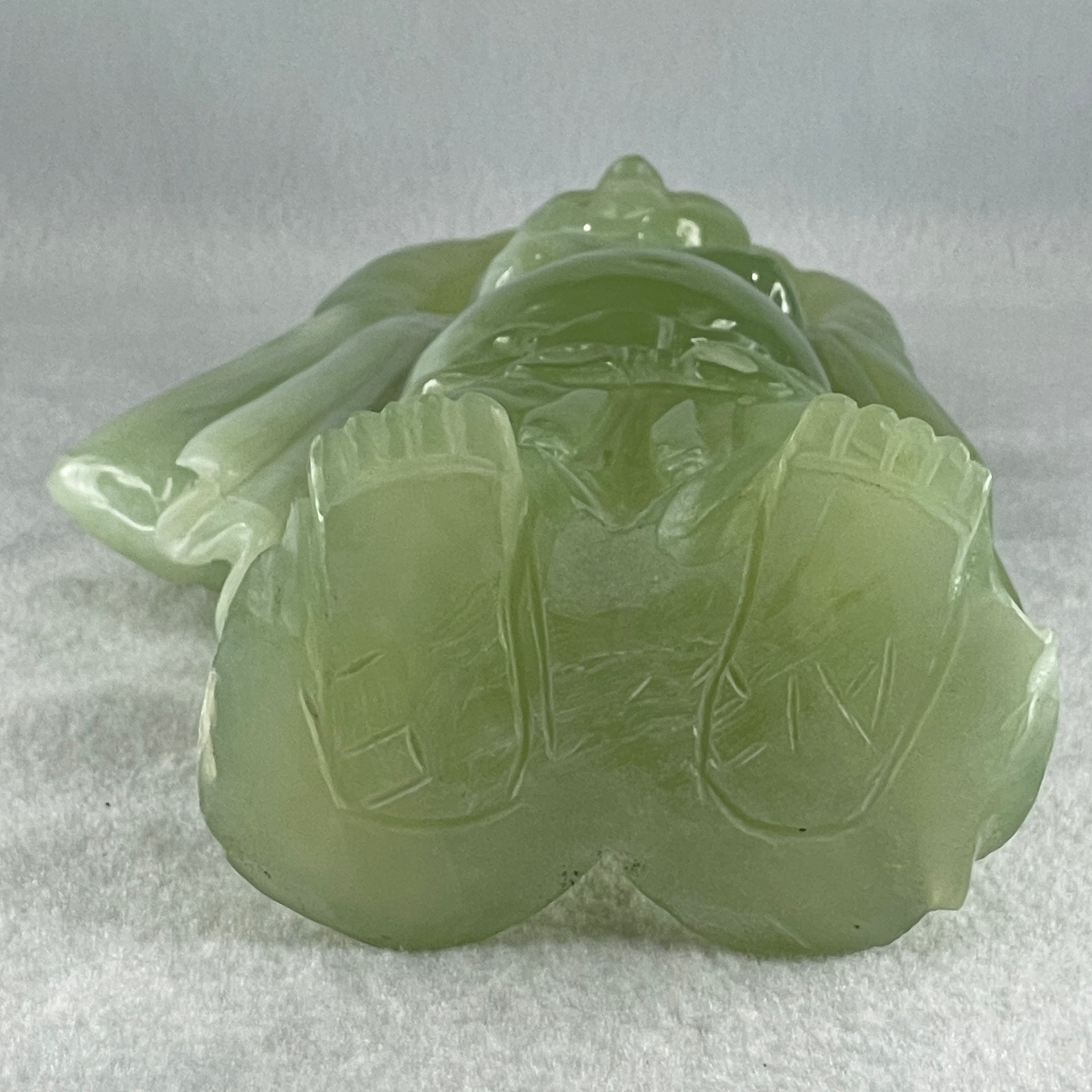 Natural Green Serpentine Stand Laughing Milo Buddha with Wealth Pot with Wooden Stand Display 1,599.3g 140.0 by 90.0 by 270.0mm - Huangs Jadeite and Jewelry Pte Ltd