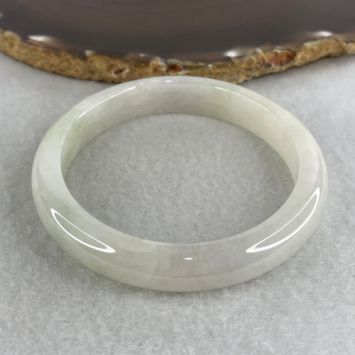 Certified Natural Type A Near White & Faint Green Jadeite Oval Bangle | 65.1mm Inner Diameter (48.42g 10.8x7.7mm | Internal Line, Slight External Rough | Pure Peace & Heart Harmony) - Huangs Jadeite and Jewelry Pte Ltd