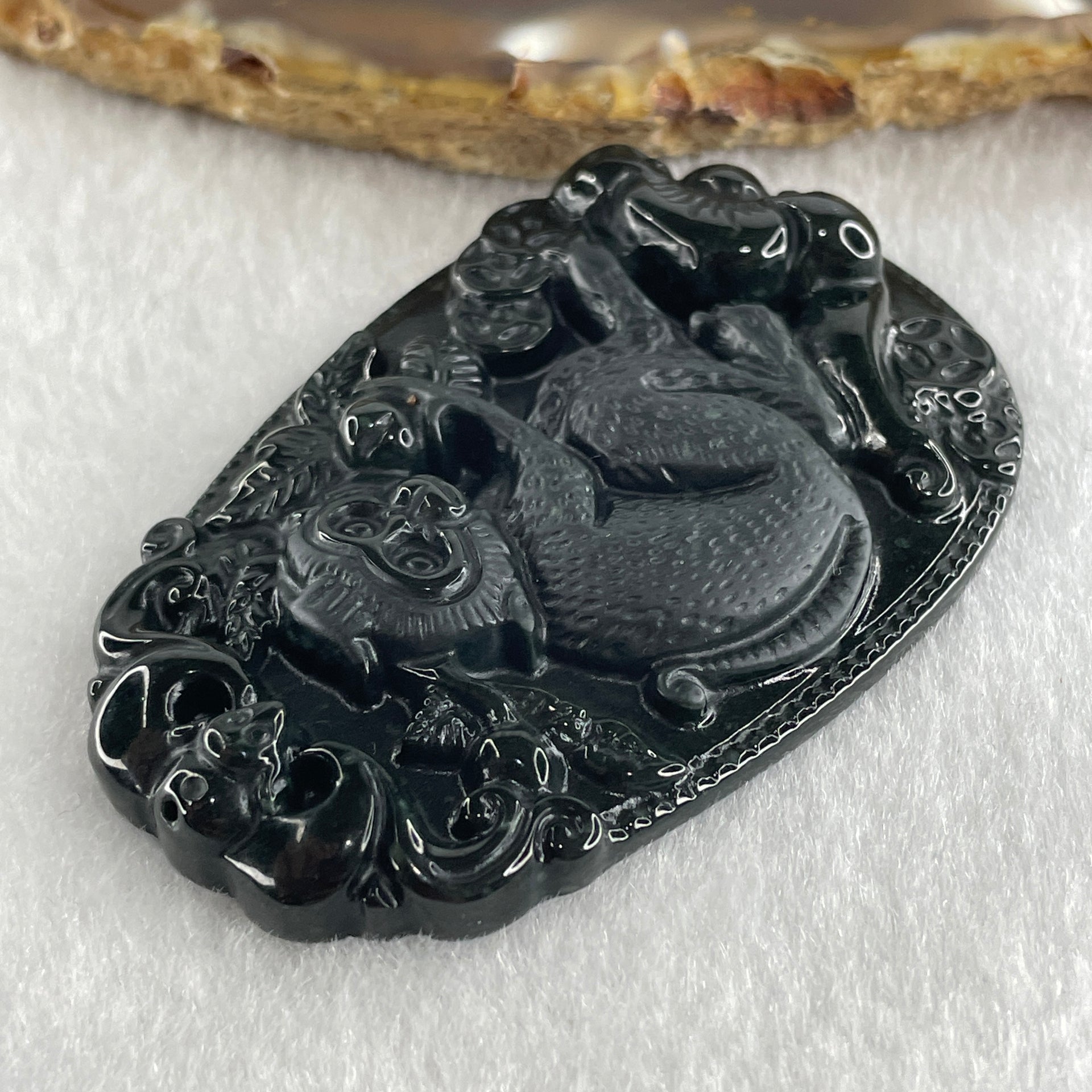 Type A Opaque to Partial Translucent Black Omphacite Jadeite Monkey Pendant 29.60g 59.6 by 40.1 by 8.5mm - Huangs Jadeite and Jewelry Pte Ltd