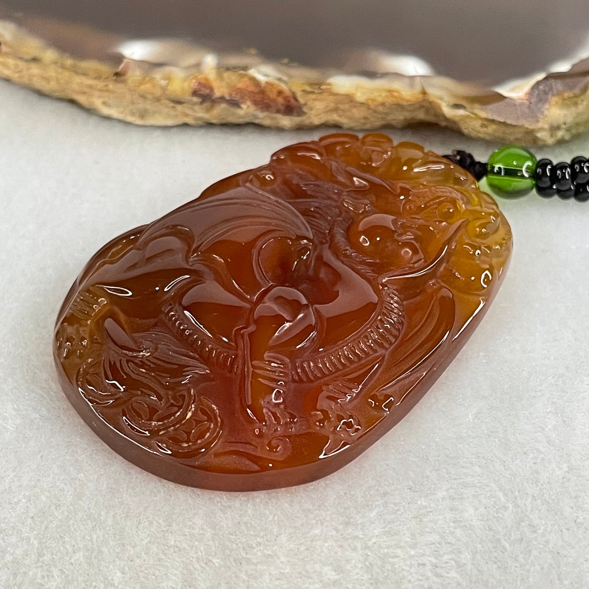 Natural Brownish Red Chalcedony Dragon Pendant 27.687g 54.1 by 38.5 by 9.1mm in Crystal Necklace 65cm - Huangs Jadeite and Jewelry Pte Ltd