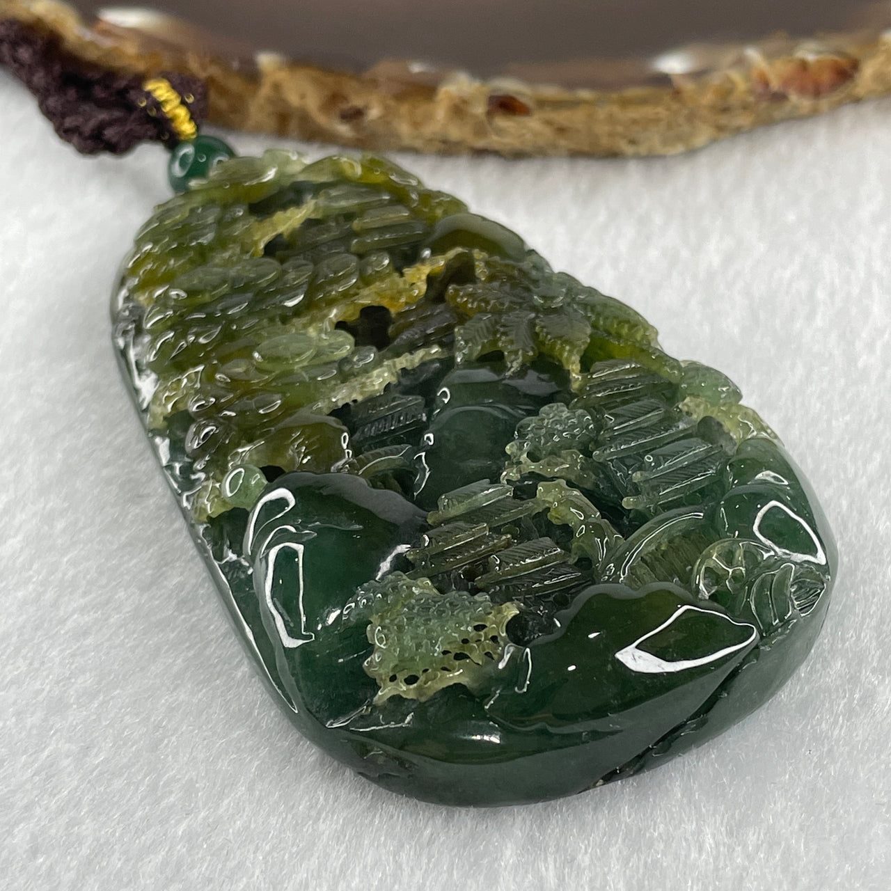 Grand Master Type Green with Brownish Yellow Jadeite Shan Shui with Gui Ren Pendant 112.63g 80.3 by 46.8 by 13.0mm