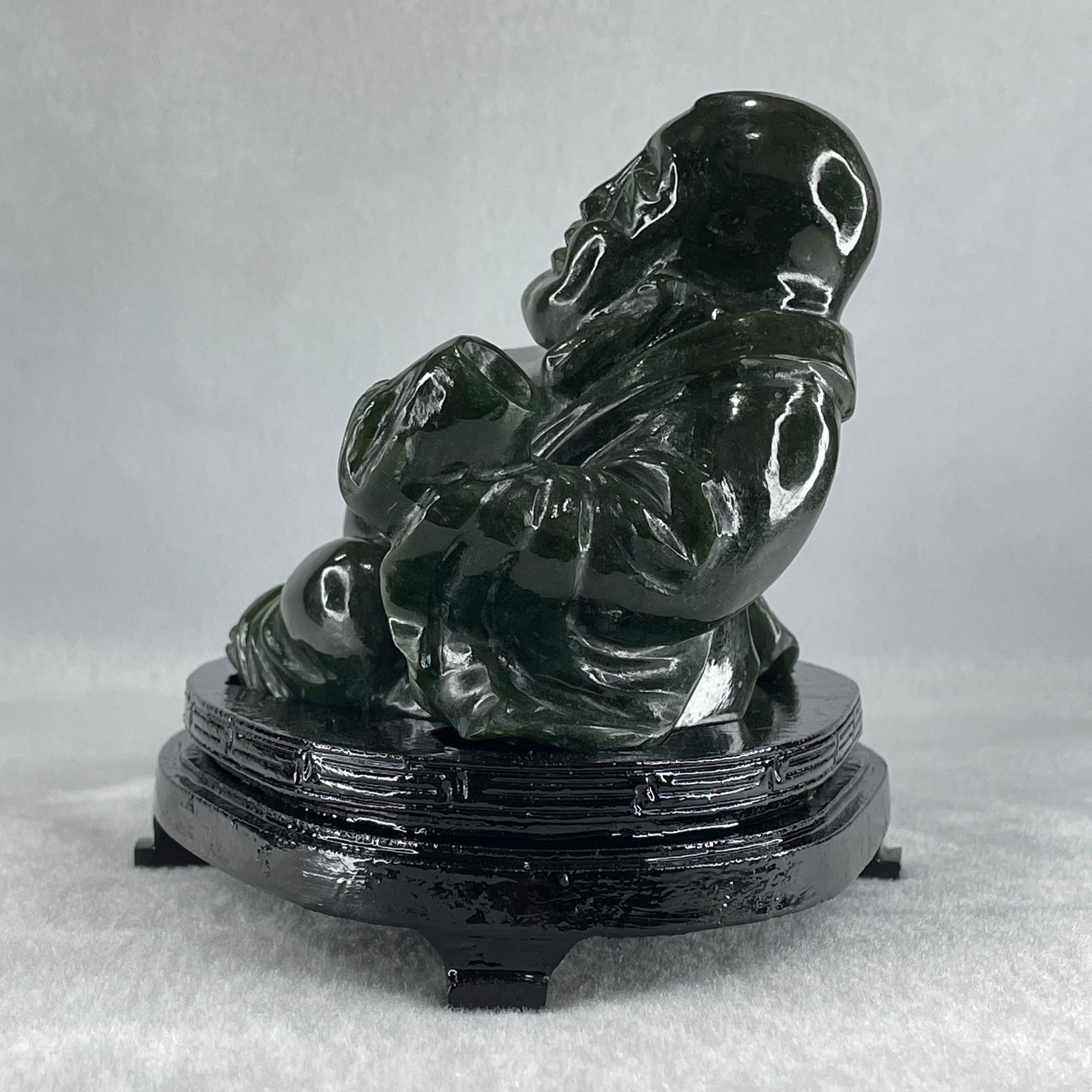 Natural Dark Green Serpentine Laughing Milo Buddha with Wealth Pot with Wooden Stand Display 1,656.6g 190.0 by 133.0 by 127.0mm - Huangs Jadeite and Jewelry Pte Ltd