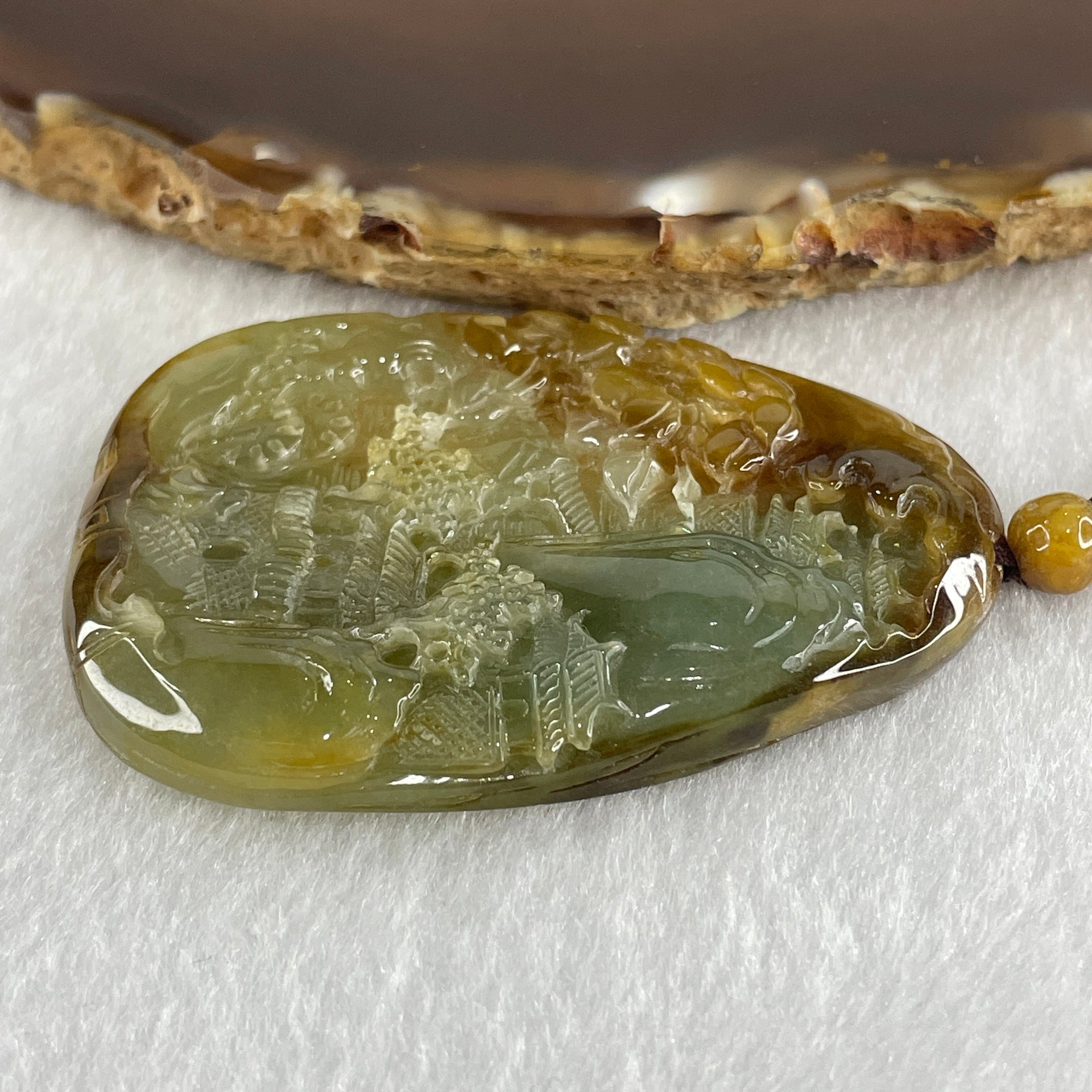 Grand Master Type A Green with Brownish Jadeite Shan Shui with Gui Ren Double Side Pendant 52.28g 55.3 by 38.2 by 7.3mm - Huangs Jadeite and Jewelry Pte Ltd