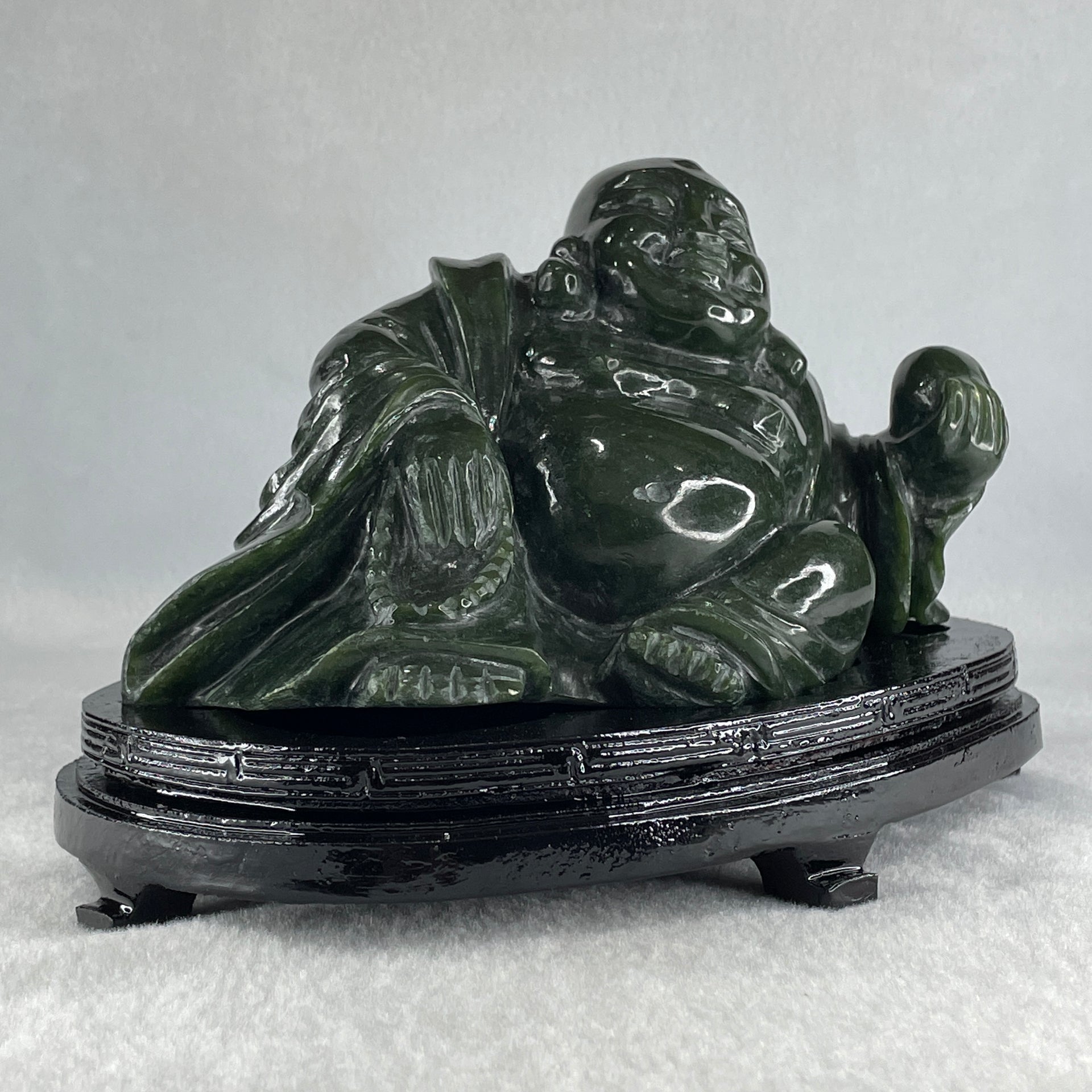 Natural Dark Green Serpentine Laughing Milo Buddha with Wealth Pot with Wooden Stand Display 1,656.6g 190.0 by 133.0 by 127.0mm - Huangs Jadeite and Jewelry Pte Ltd