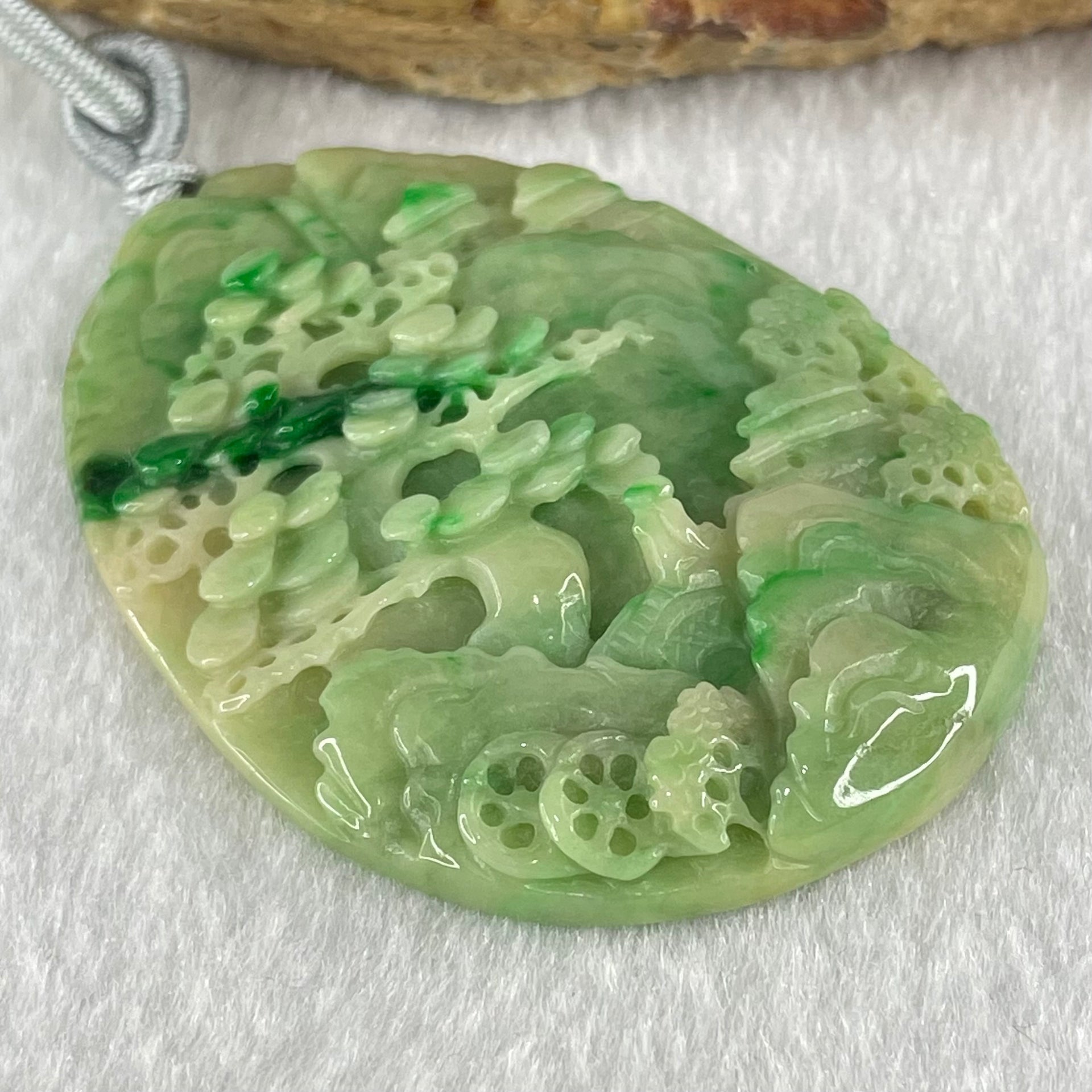 Type A Green with Yellow Spicy Green Piao Hua and Light Brown Patches Jadeite Double Sided Shan Shui with Gui Ren Benefactor Pendant 30.43g 54.0 by 40.8 by 8.4mm - Huangs Jadeite and Jewelry Pte Ltd