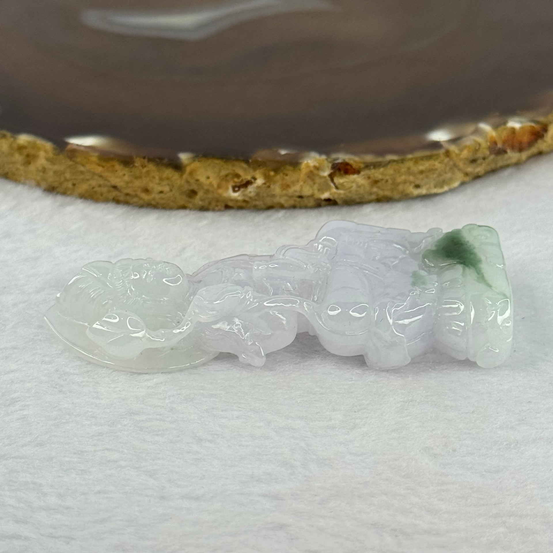 Type A Light Lavender with Green Patches Jadeite Guan Yin Pendent with Wooden Stand 111.55g  111.8 by 58.7 by 46.6mm - Huangs Jadeite and Jewelry Pte Ltd