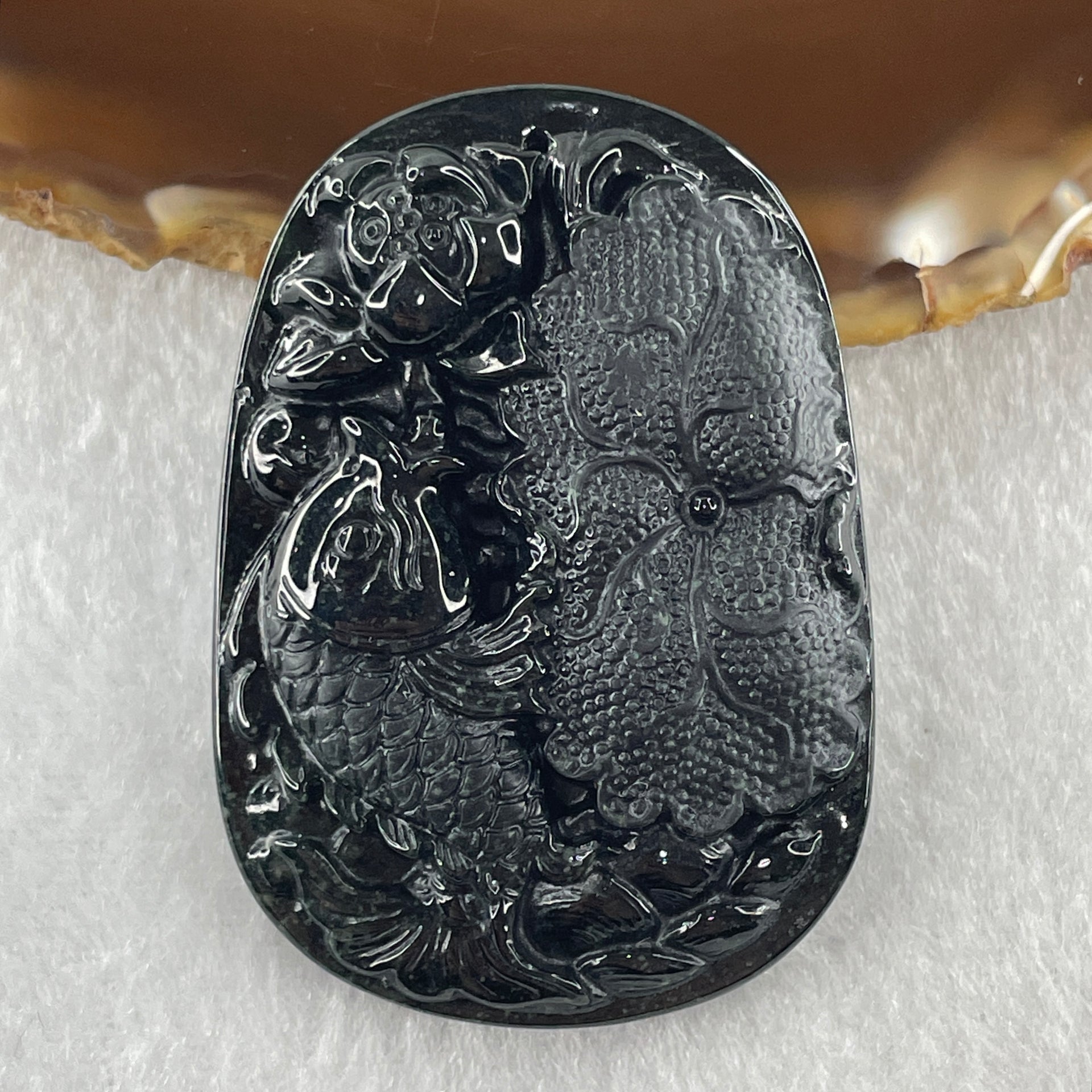 Type A Opaque to Partial Translucent Black Omphacite Jadeite Fish with Lotus Flower and Leaf Pendant 24.60g 51.1 by 35.9 by 8.8mm - Huangs Jadeite and Jewelry Pte Ltd