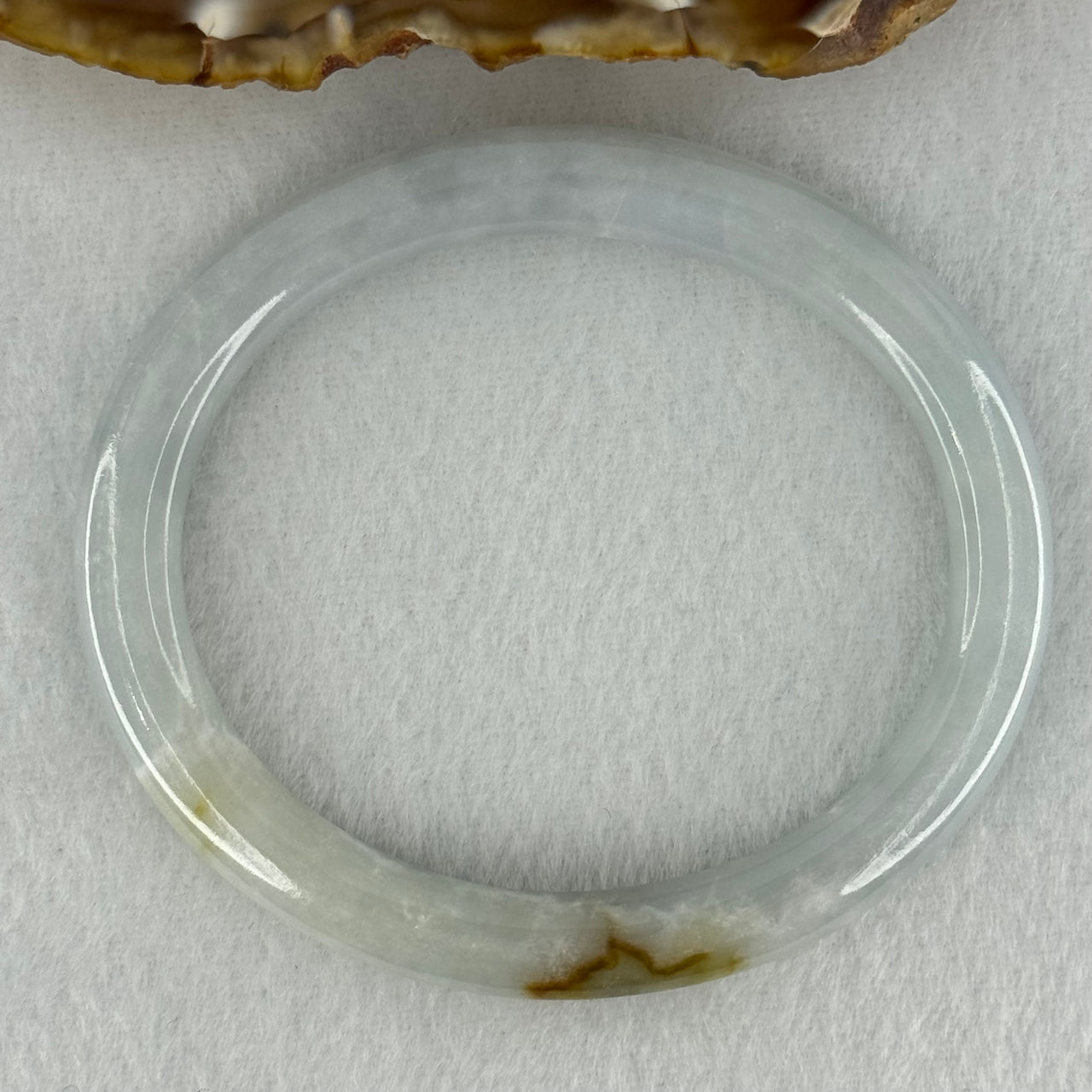 Type A Sky Blue with Green and Brown Patch Jadeite Oval Bangle Internal Diameter 58.0mm 32.09g 7.4 by 7.9mm (External Rough with Internal Lines) - Huangs Jadeite and Jewelry Pte Ltd