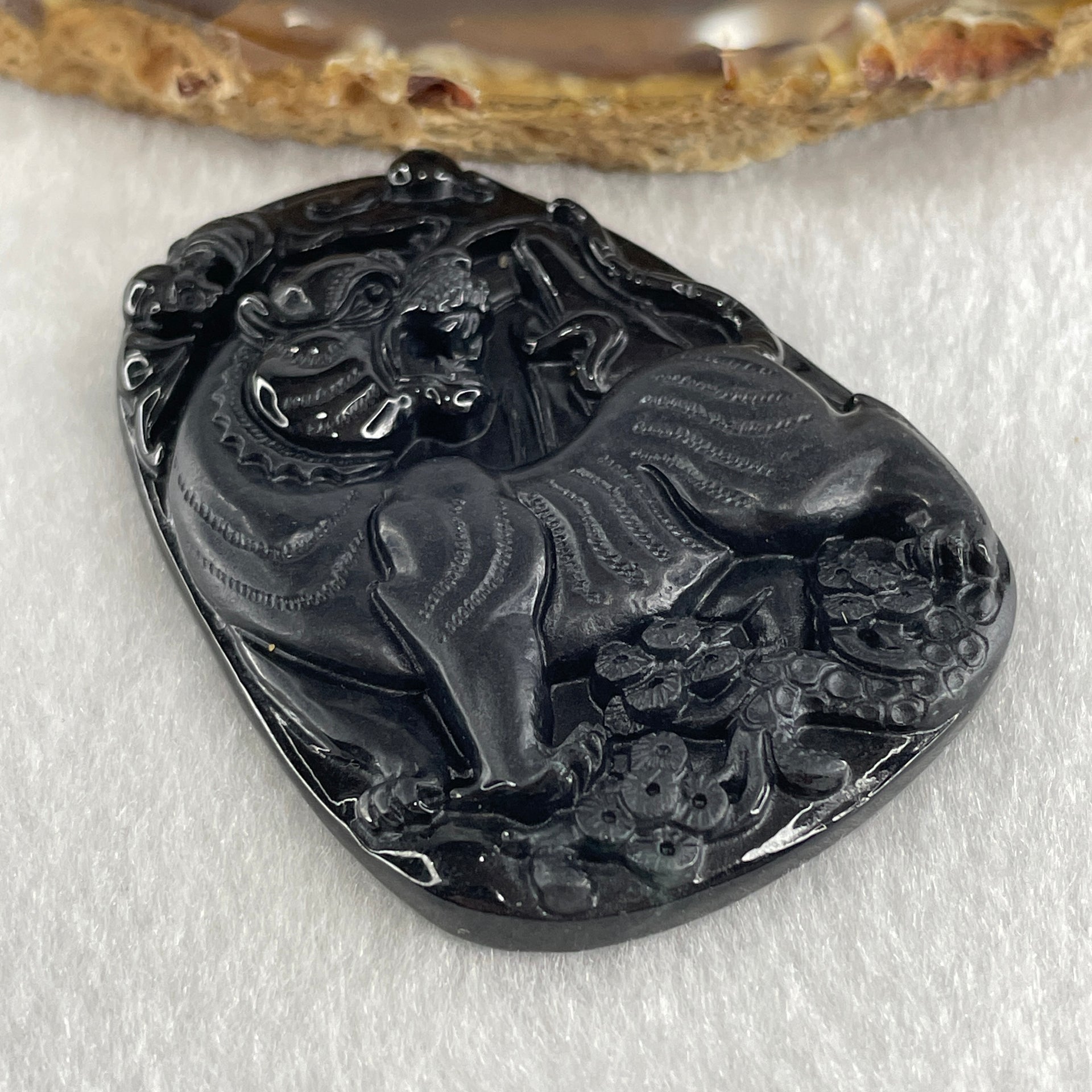 Type A Opaque to Partial Translucent Black Omphacite Jadeite Tiger Pendant 24.24g 56.8 by 40.5 by 7.5mm - Huangs Jadeite and Jewelry Pte Ltd