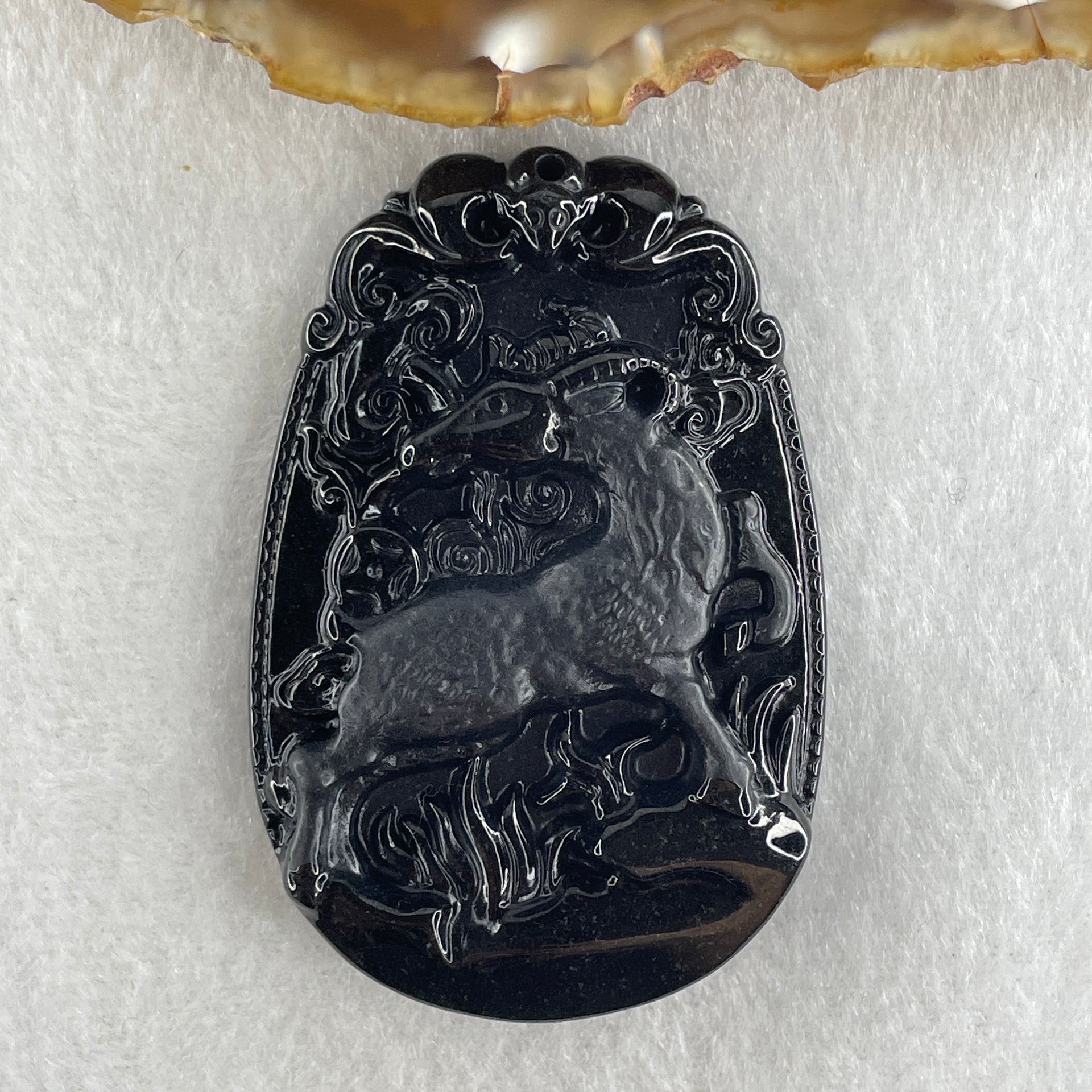 Type A Opaque to Partial Translucent Black Omphacite Jadeite Goat Pendant 27.85g 59.9 by 40.6 by 9.8mm - Huangs Jadeite and Jewelry Pte Ltd