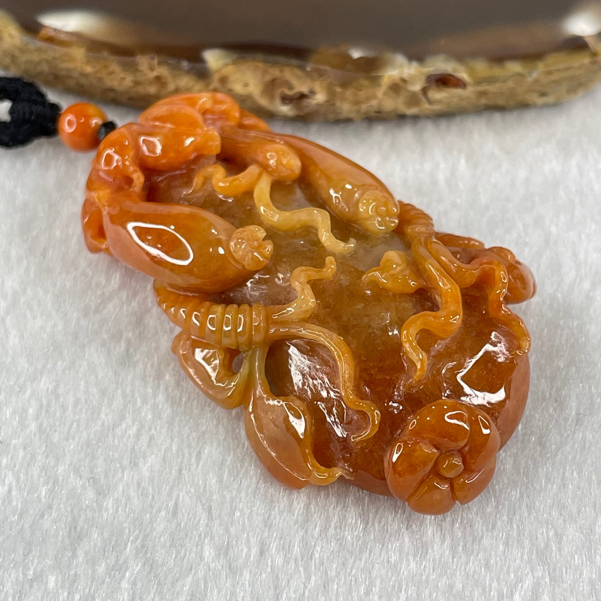 Grandmaster Type A Brownish Orange to Brownish Red Jadeite Melon and Ruyi 福瓜 Pendant 45.95g 58.05 by 34.38 by 15.00mm With NGI Cert 82838787 - Huangs Jadeite and Jewelry Pte Ltd