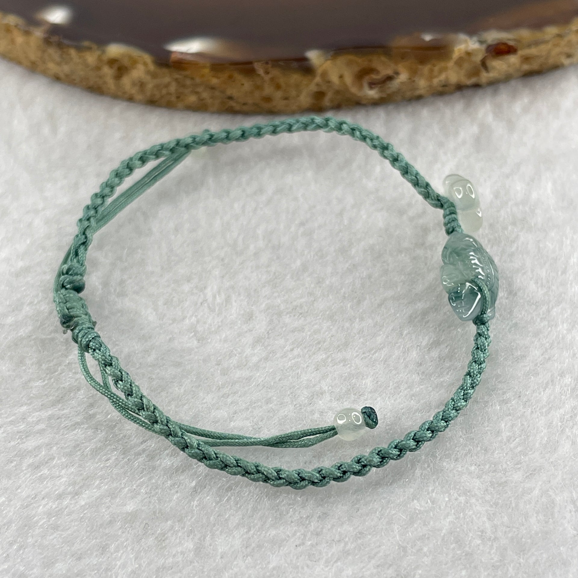 Natural Type A Semi Icy Green with Dark Green Patches Jadeite Fish with Flower on String Bracelet 1.59g 15-18cm 15.6 by 7.9 by 3.5mm - Huangs Jadeite and Jewelry Pte Ltd