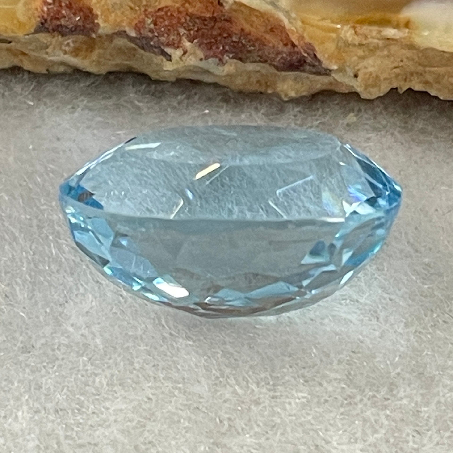 Natural Sky Blue Topaz Oval Shape 12.31ct 14.8 by 12.0 by 8.1mm - Huangs Jadeite and Jewelry Pte Ltd
