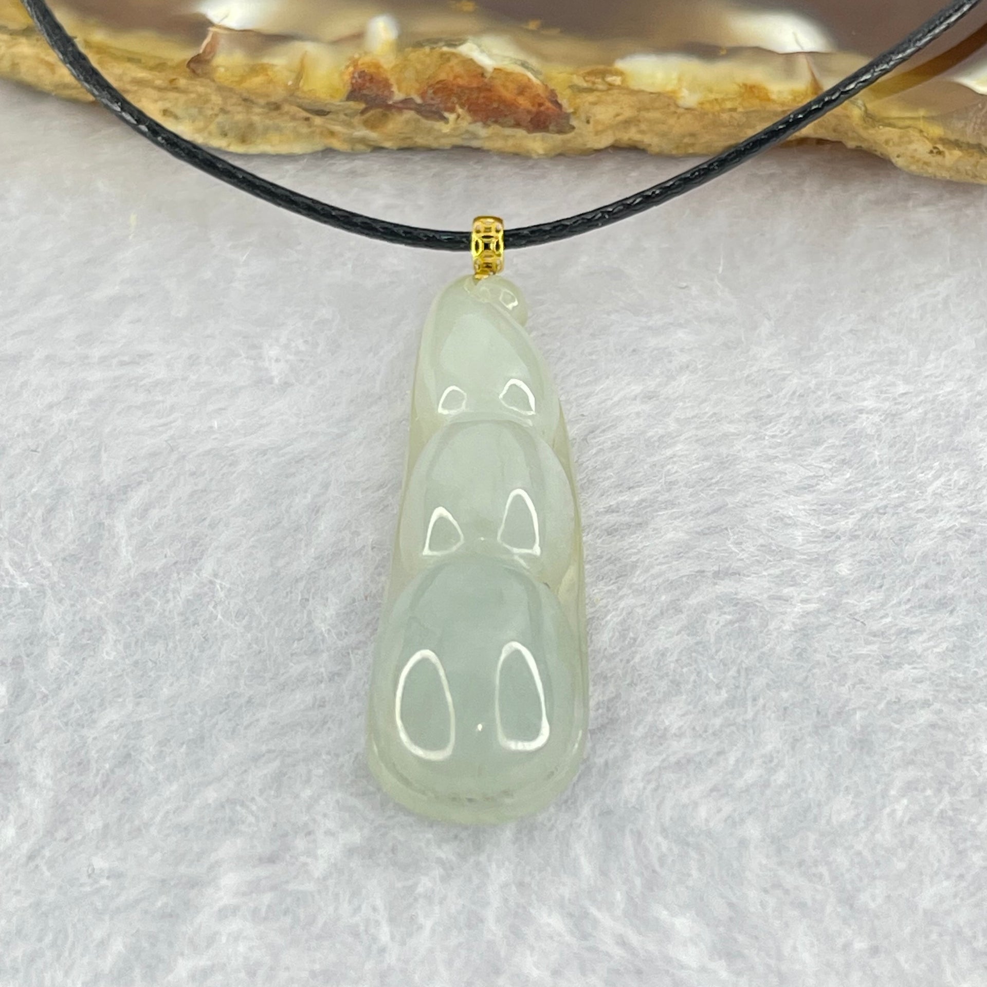 Type A Faint Green Jadeite Peapod Pendent 6.17g 39.1 by 11.3 by 7.1mm - Huangs Jadeite and Jewelry Pte Ltd