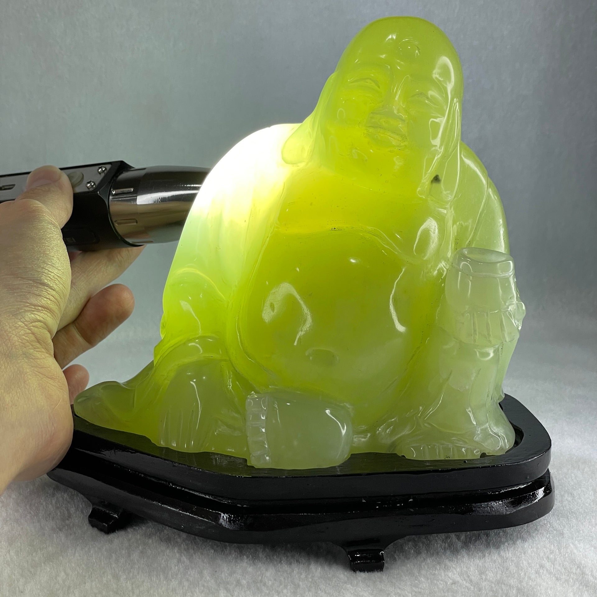 Natural Green Serpentine Siting Milo Buddha with Wealth Pot with Wooden Stand Display 1362.0g 165.0 by 110.0 by 150.0mm - Huangs Jadeite and Jewelry Pte Ltd