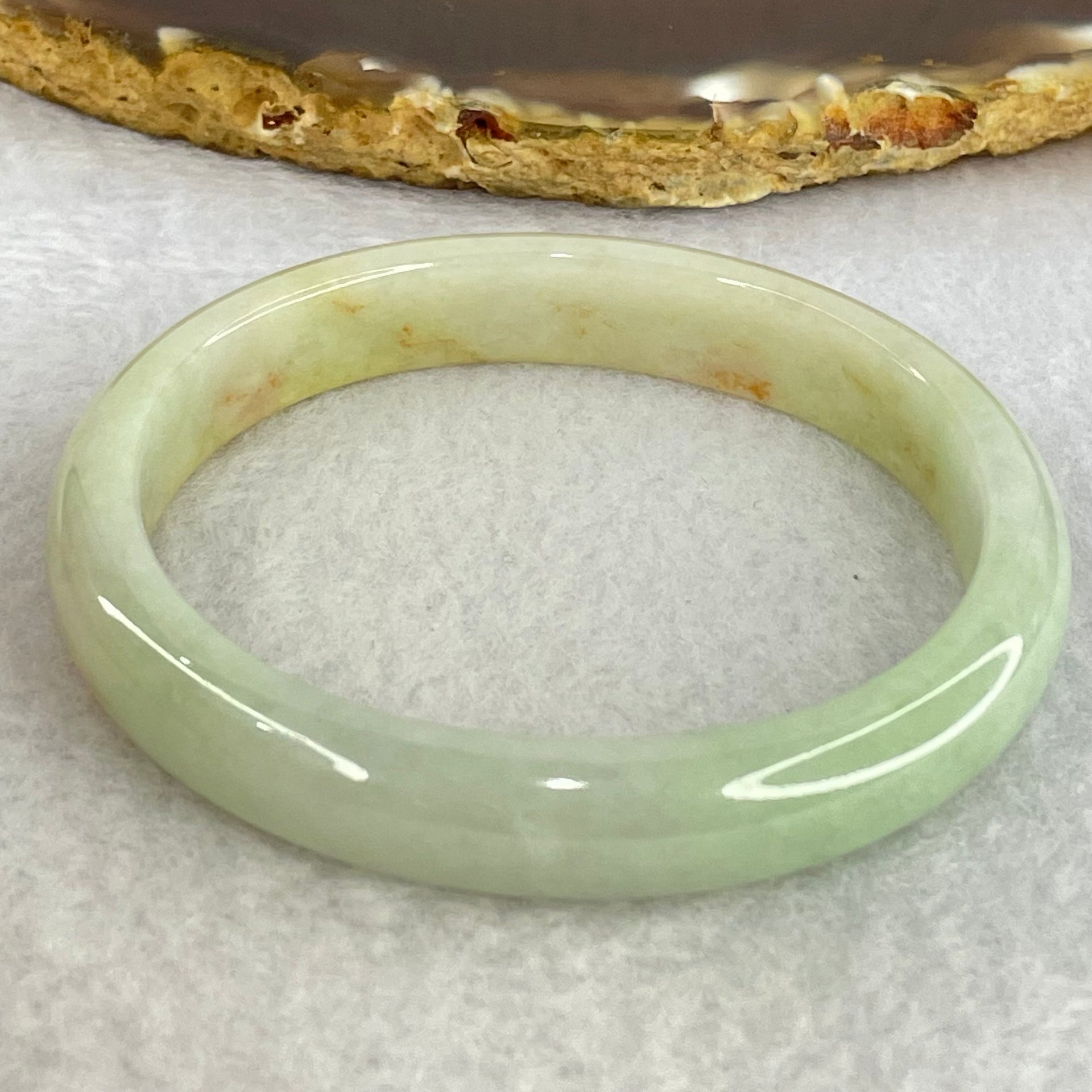 Type A Light Blueish Green and Red and Brown Patches Jadeite Oval Bangle Internal Diameter 54.3mm 32.17g 10.4 by 6.5mm (Very Slight Internal Lines) - Huangs Jadeite and Jewelry Pte Ltd