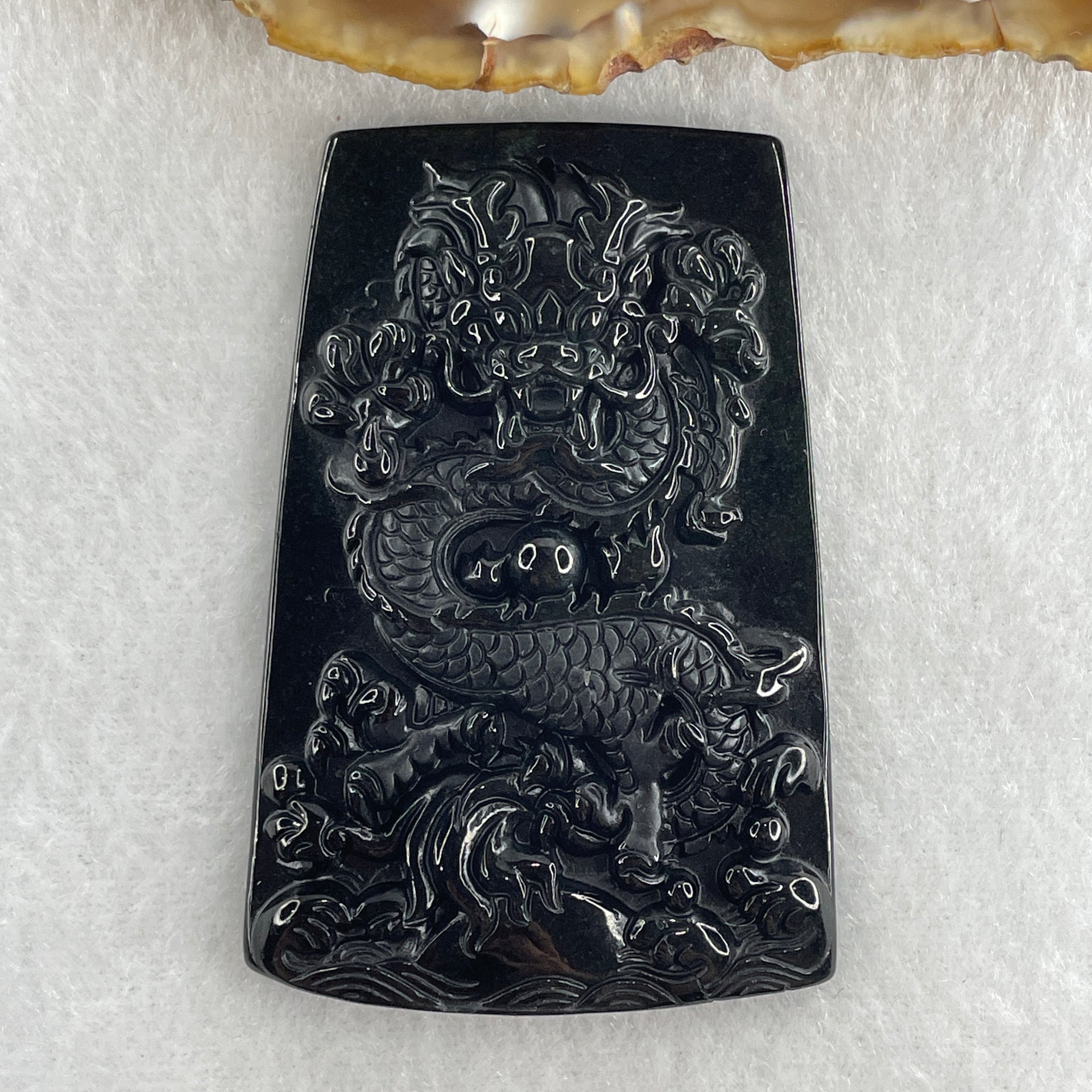 Type A Opaque to Partial Translucent Black Omphacite Jadeite Dragon Pendant 30.25g 64.4 by 42.8 by 8.2mm - Huangs Jadeite and Jewelry Pte Ltd