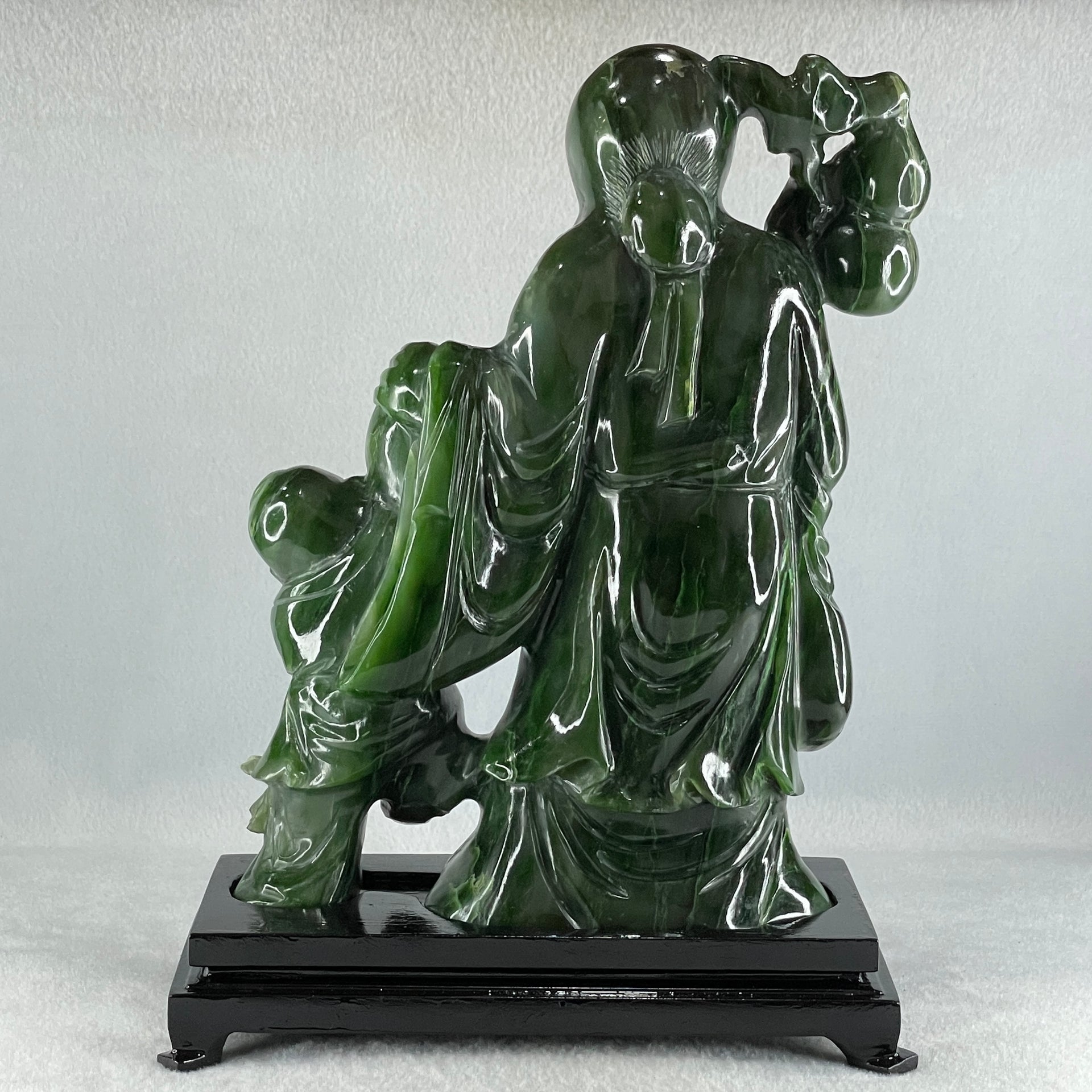 Natural Dark Green Serpentine Shou Xing Gong and Tong Zi and Longevity Peach with Wooden Stand Display 3,091.3g 193.0 by 95.0 by 257.0mm - Huangs Jadeite and Jewelry Pte Ltd
