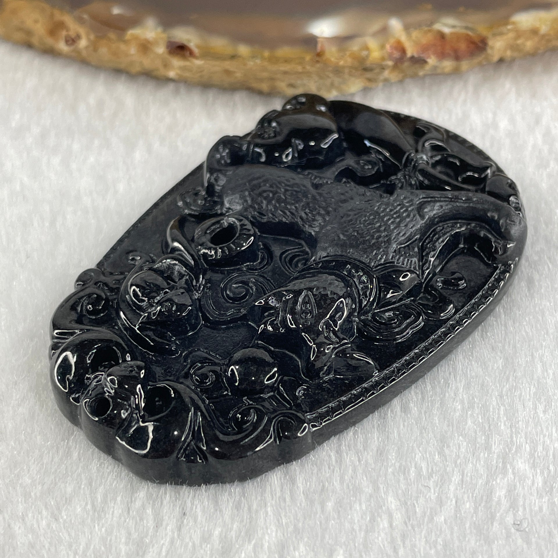 Type A Opaque to Partial Translucent Black Omphacite Jadeite Dog Pendant 23.89g 59.8 by 39.8 by 8.6mm - Huangs Jadeite and Jewelry Pte Ltd