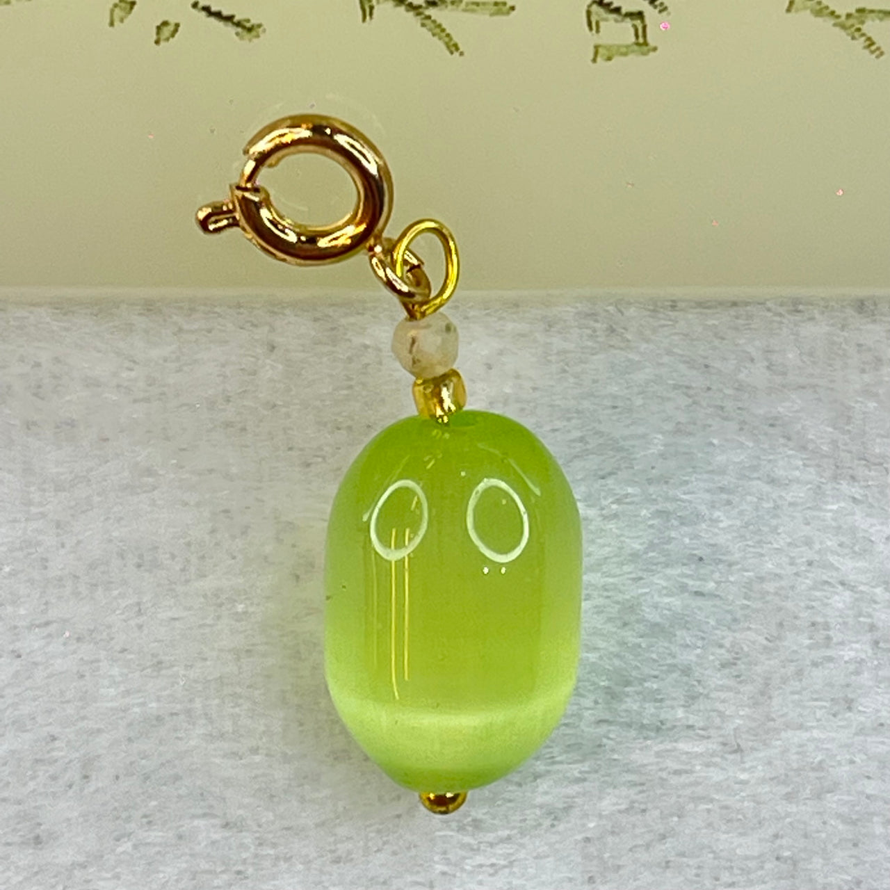 Green Cat's Eye Glass Charm Pendent 2.48g 14.3m by 9.8mm - Huangs Jadeite and Jewelry Pte Ltd