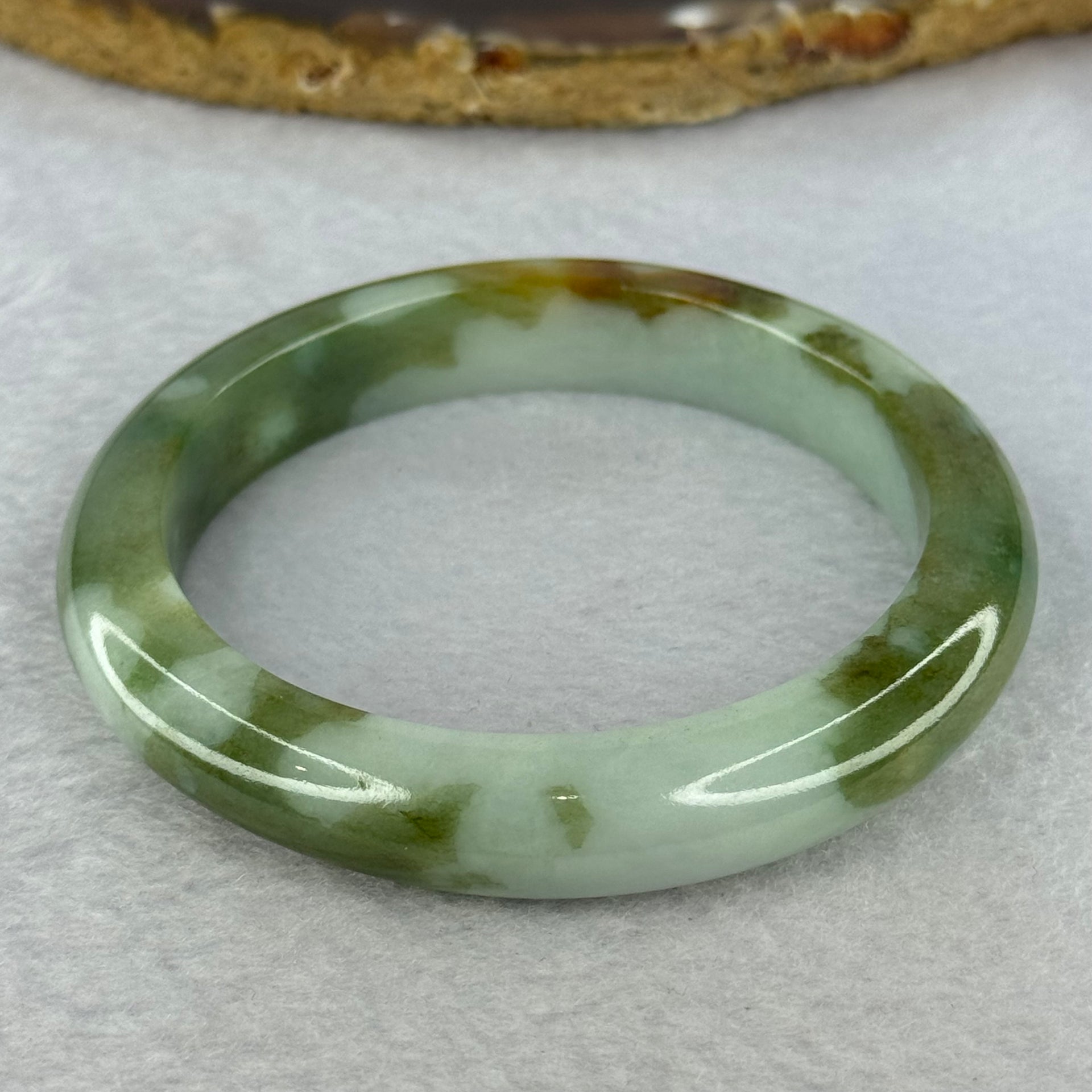 Type A Light Green and Moss Green and Brown Patches Jadeite Bangle 55.5mm 51.12g 10.6 by 9.0mm (Slight Internal Line) - Huangs Jadeite and Jewelry Pte Ltd