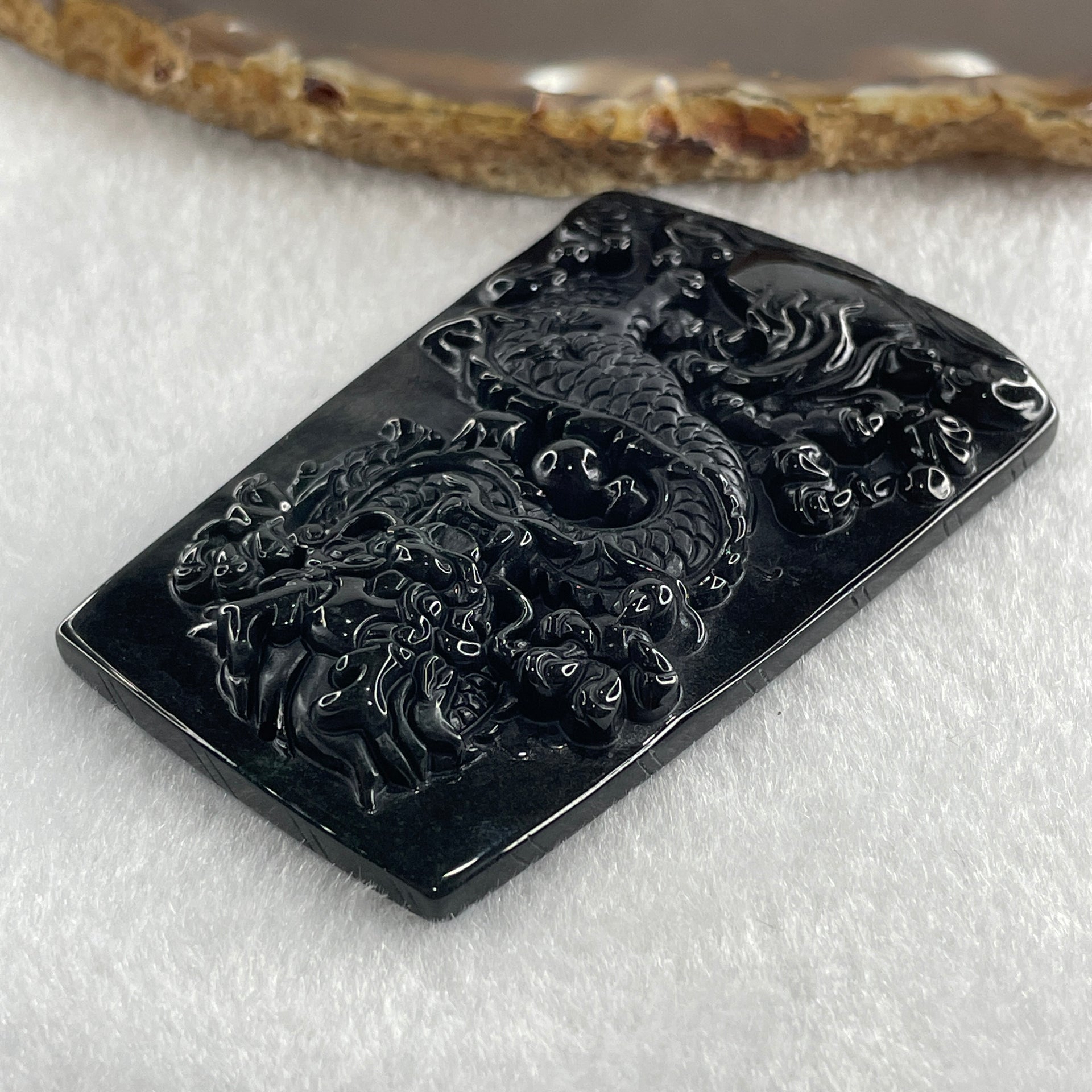 Type A Opaque to Partial Translucent Black Omphacite Jadeite Dragon Pendant 30.25g 64.4 by 42.8 by 8.2mm - Huangs Jadeite and Jewelry Pte Ltd