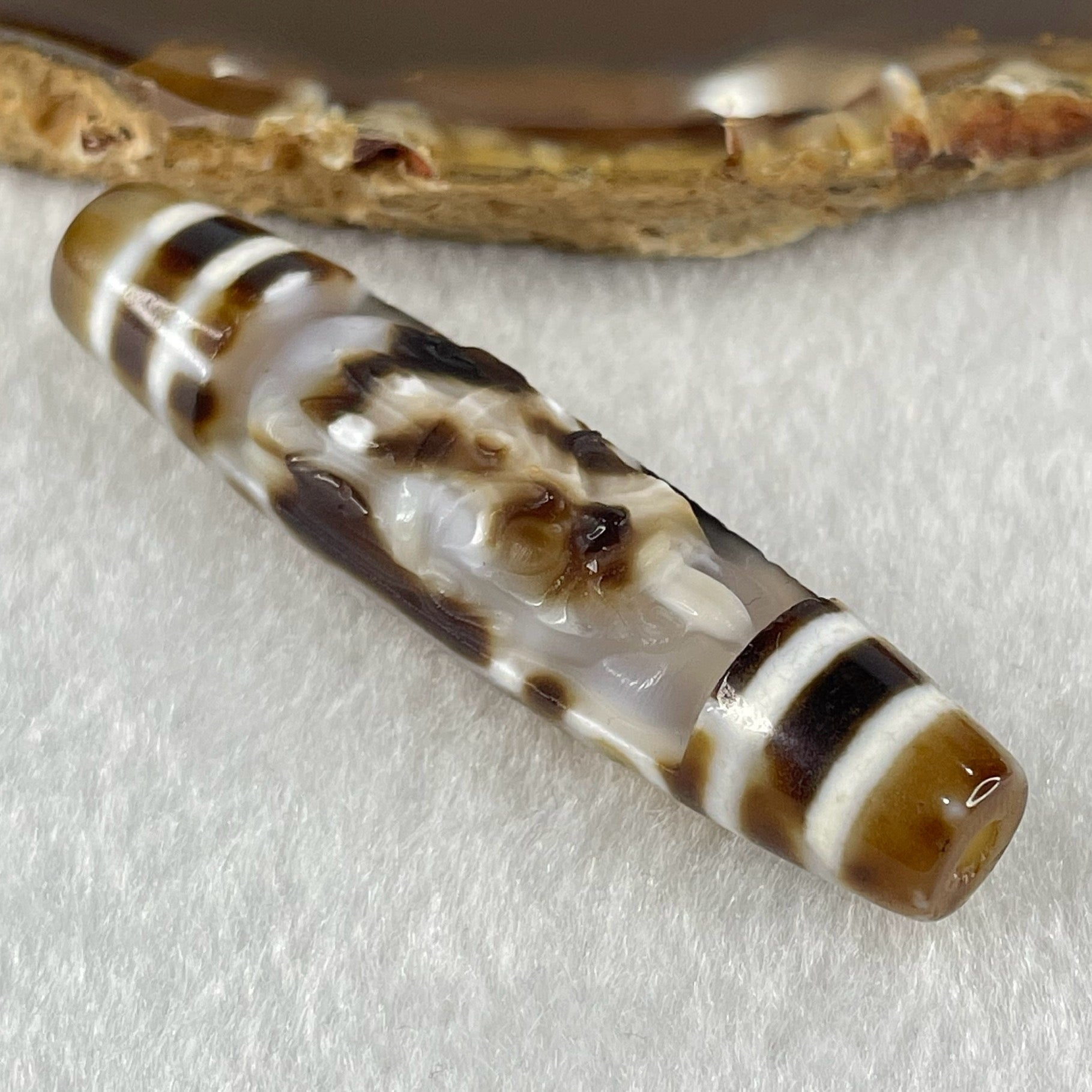 Natural Powerful Tibetan Old Oily Agate Zha Ji La Mu Female Cai Shen Carvings on 9 Eyes Dzi Bead Heavenly Master (Tian Zhu) 九眼扎基拉姆女财神天珠 13.88g 57.4 by 13.3mm - Huangs Jadeite and Jewelry Pte Ltd