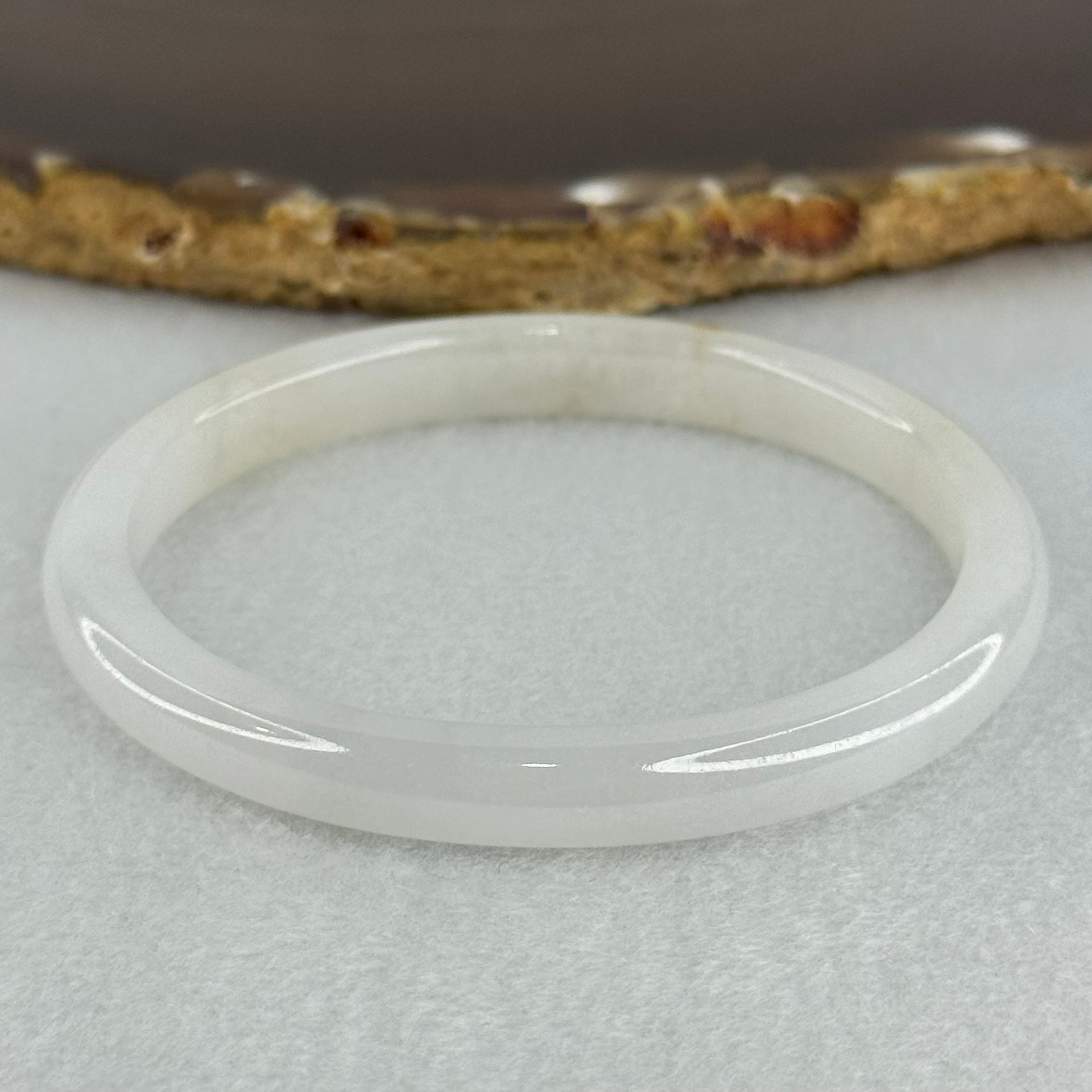 Type A Semi Icy Faint Lavender Green with Reddish Spot Jadeite Oval Bangle Internal Diameter 54.4mm 21.33g 7.5 by 6.0mm (very slight internal line) - Huangs Jadeite and Jewelry Pte Ltd