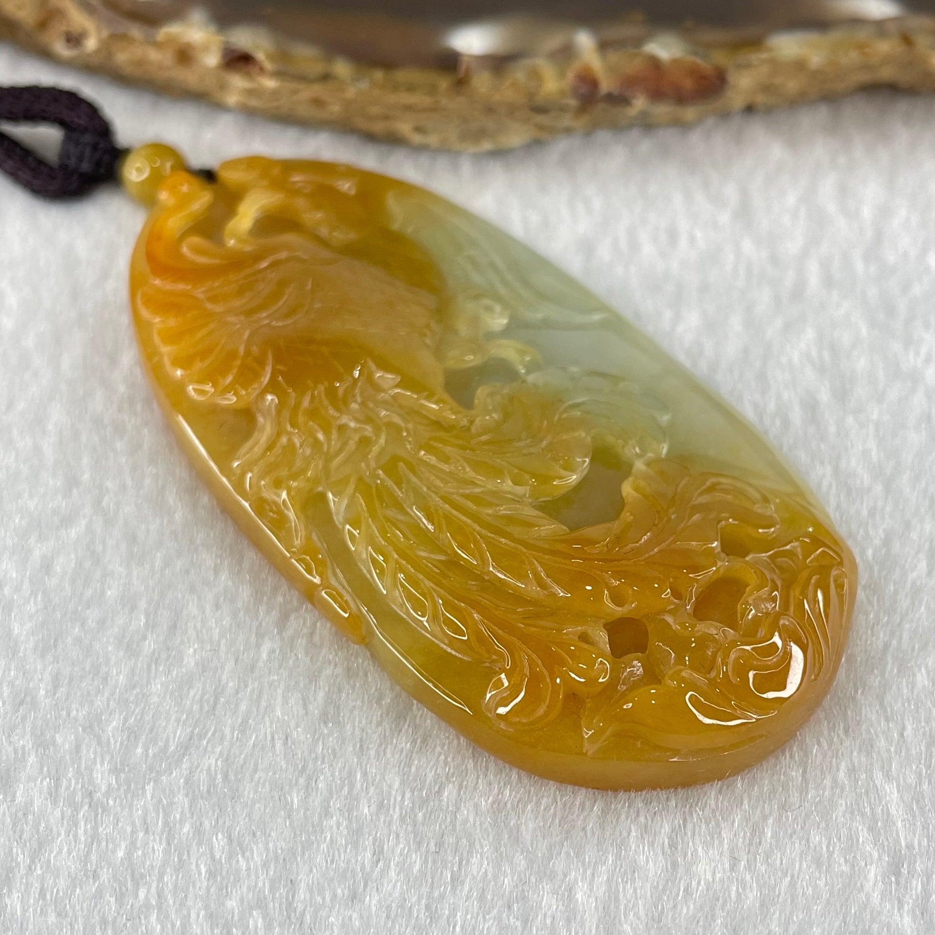 Grandmaster Type A Reddish Brown with Faint Lavender Green Jadeite Phoenix 凤戏牡丹 Pendant 41.26g 64.96 by 35.02 by 9.52mm With NGI Cert 82838779 - Huangs Jadeite and Jewelry Pte Ltd