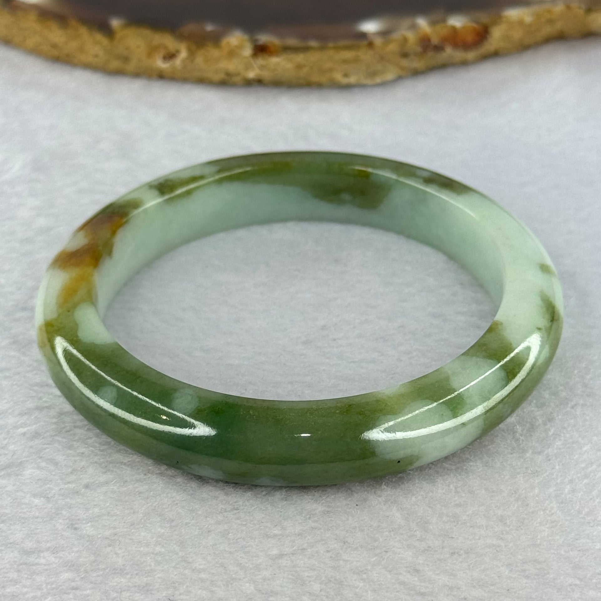 Type A Light Green and Moss Green and Brown Patches Jadeite Bangle 55.5mm 51.12g 10.6 by 9.0mm (Slight Internal Line) - Huangs Jadeite and Jewelry Pte Ltd