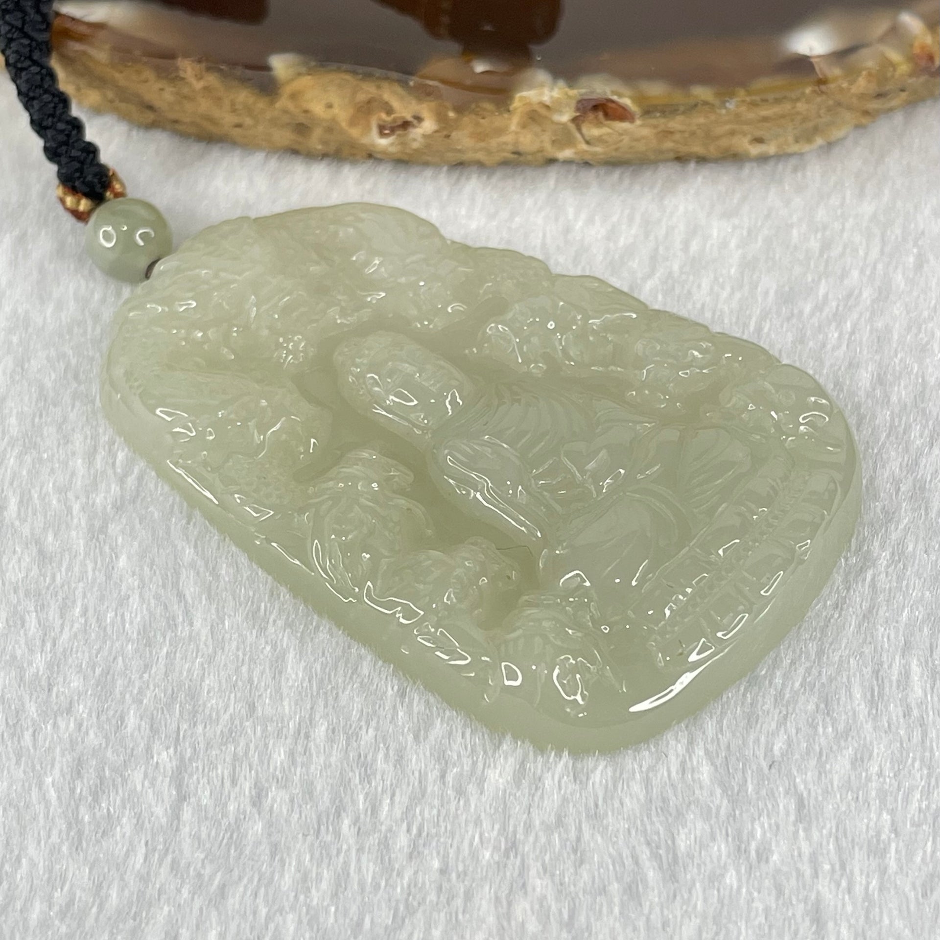 Type A Semi Icy Light Green Jadeite Buddha with 9 Dragons Pendant 27.39g 57.6 by 39.0 by 6.4mm - Huangs Jadeite and Jewelry Pte Ltd