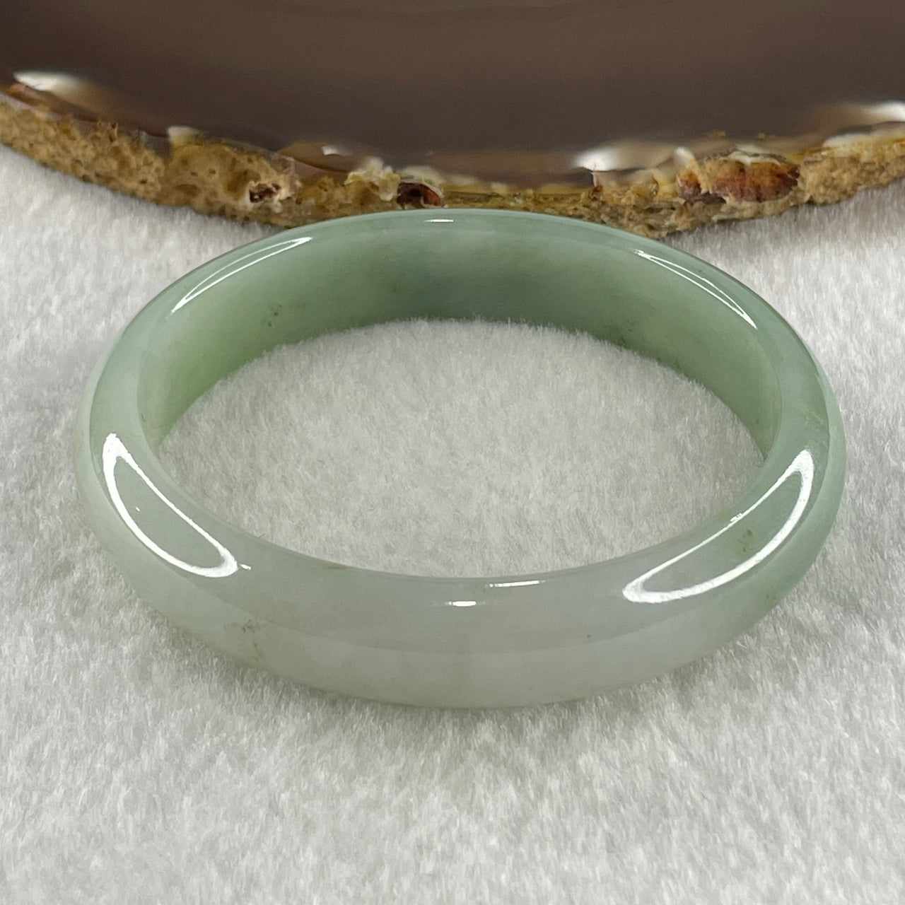 Natural Type A Jelly Light to Faint Green Jadeite Oval Bangle 36.74g Inner Diameter 55.0mm 12.0 by 6.5mm (Close to Perfect) - Huangs Jadeite and Jewelry Pte Ltd