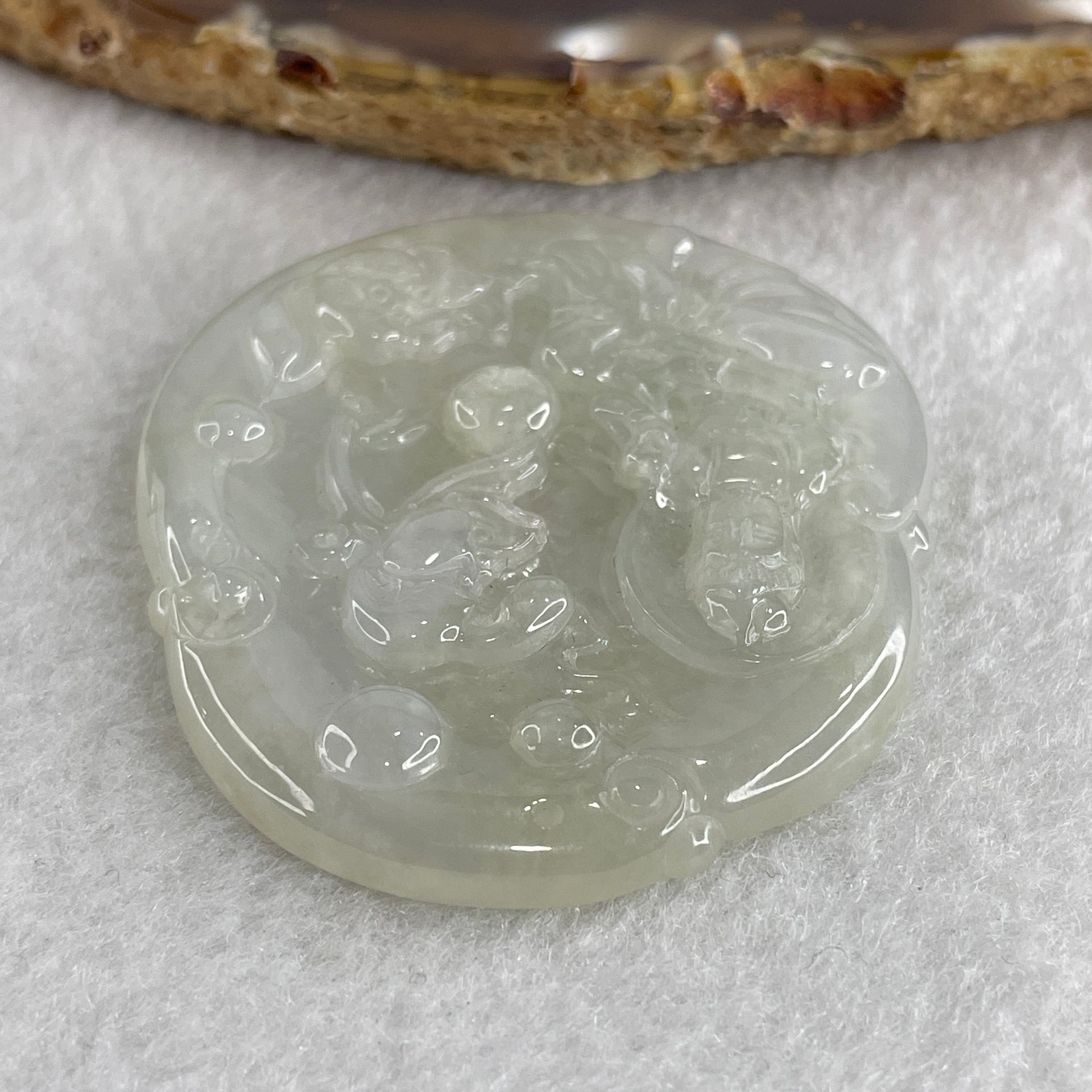 Natural Type A Semi Icy Colorless Jadeite Guan Yin with Lotus Flower Pendant 23.37g 52.8 by 46.7 by 5.2mm - Huangs Jadeite and Jewelry Pte Ltd