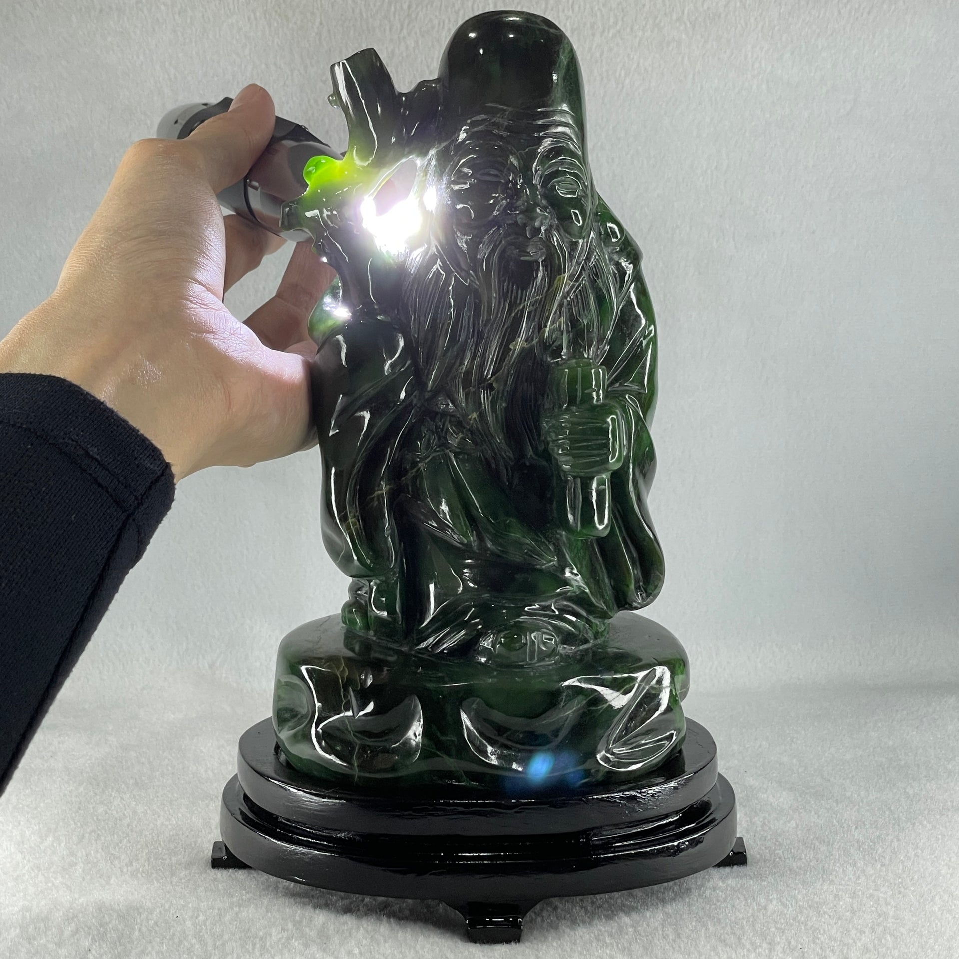 Natural Dark Green Serpentine Shou Xing Gong with Wooden Stand Display 2,374.7g 140.0 by 228.0 by 125.0mm - Huangs Jadeite and Jewelry Pte Ltd