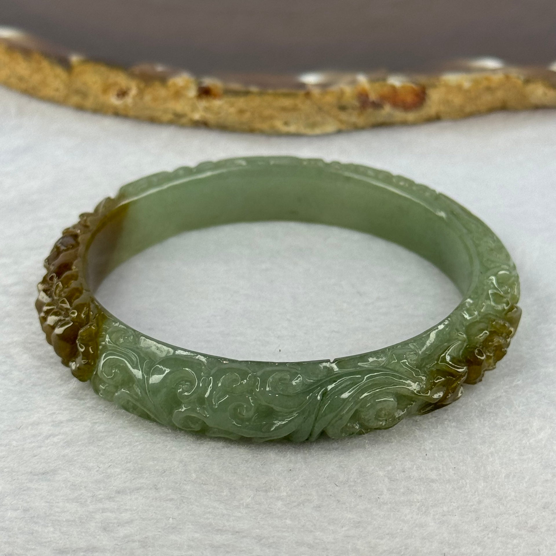 Type A Blueish Green and Brown Patches Jadeite Lotus Flowers Bangle 39.19g Internal Diameter 55.2mm 10.9 by 8.2mm - Huangs Jadeite and Jewelry Pte Ltd