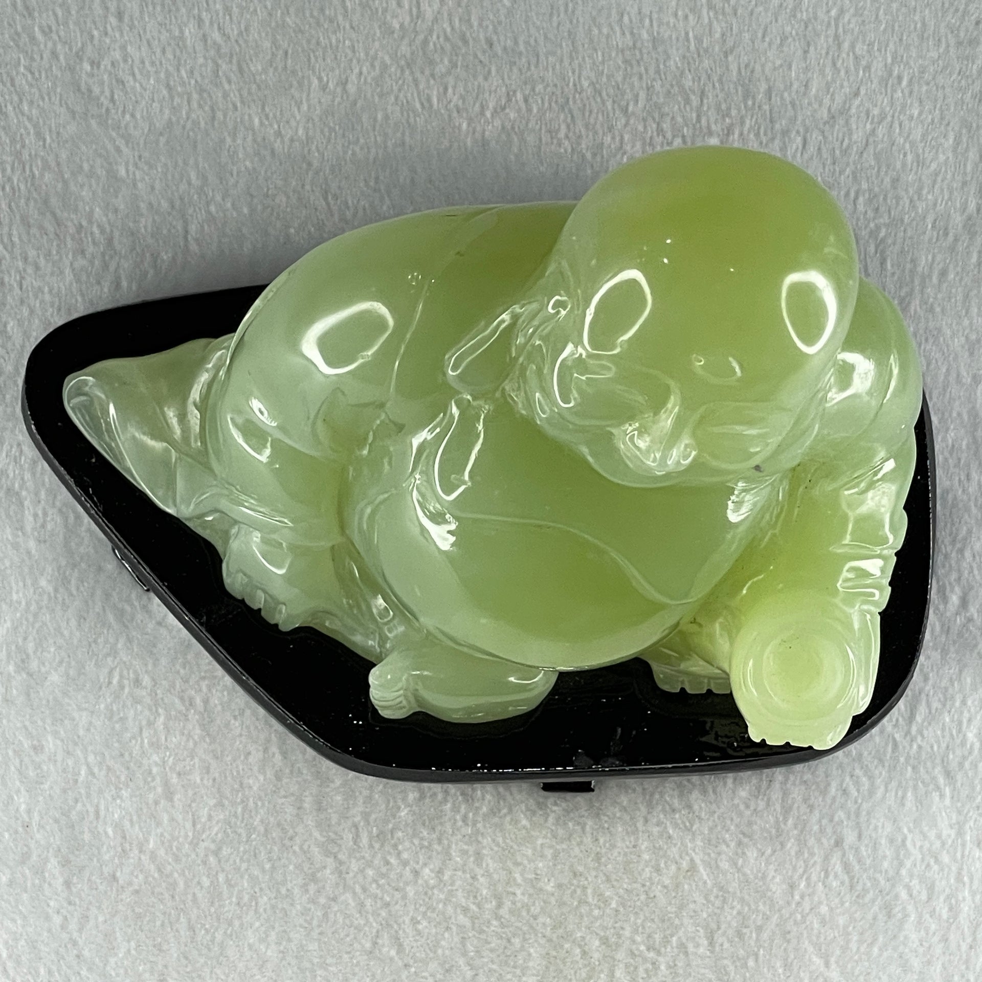 Natural Green Serpentine Siting Milo Buddha with Wealth Pot with Wooden Stand Display 1362.0g 165.0 by 110.0 by 150.0mm - Huangs Jadeite and Jewelry Pte Ltd