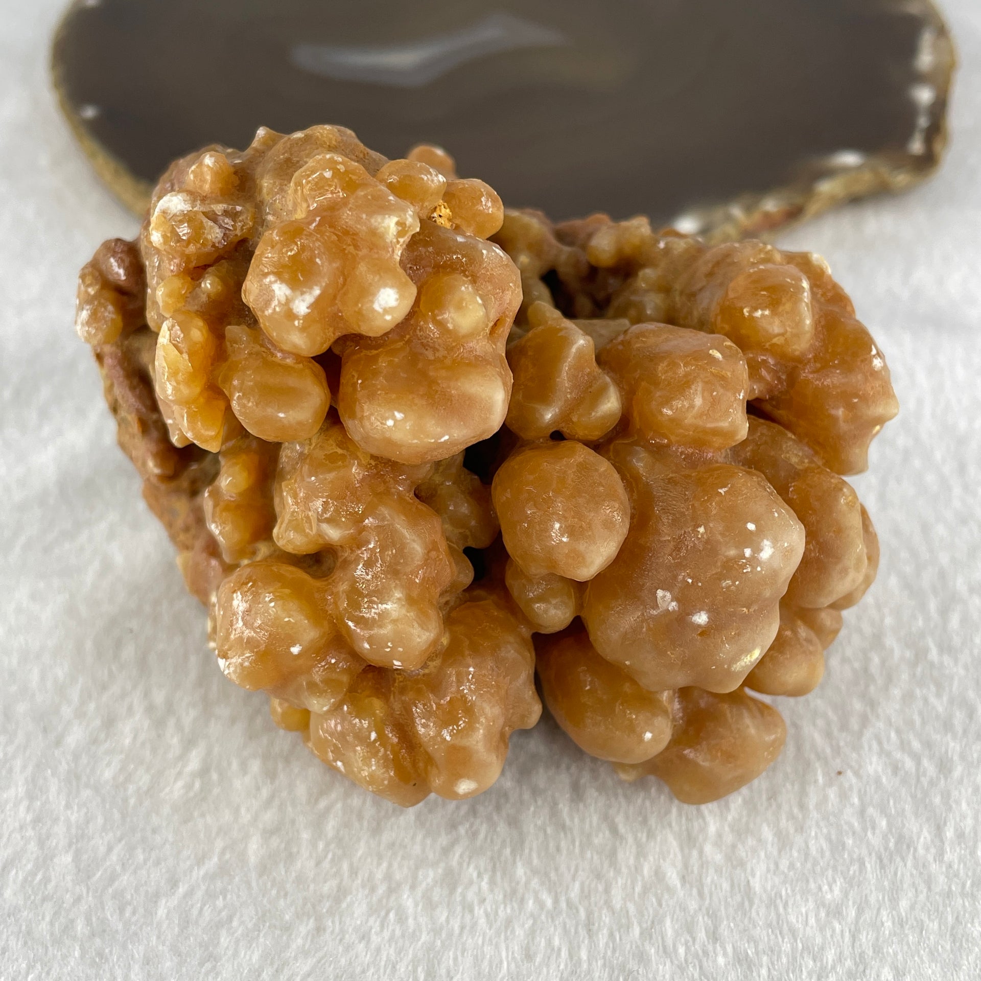 Natural Orange Calcite Rough Display with Wooden Stand 540.6g 109.7 by 94.1 by 123.0mm - Huangs Jadeite and Jewelry Pte Ltd
