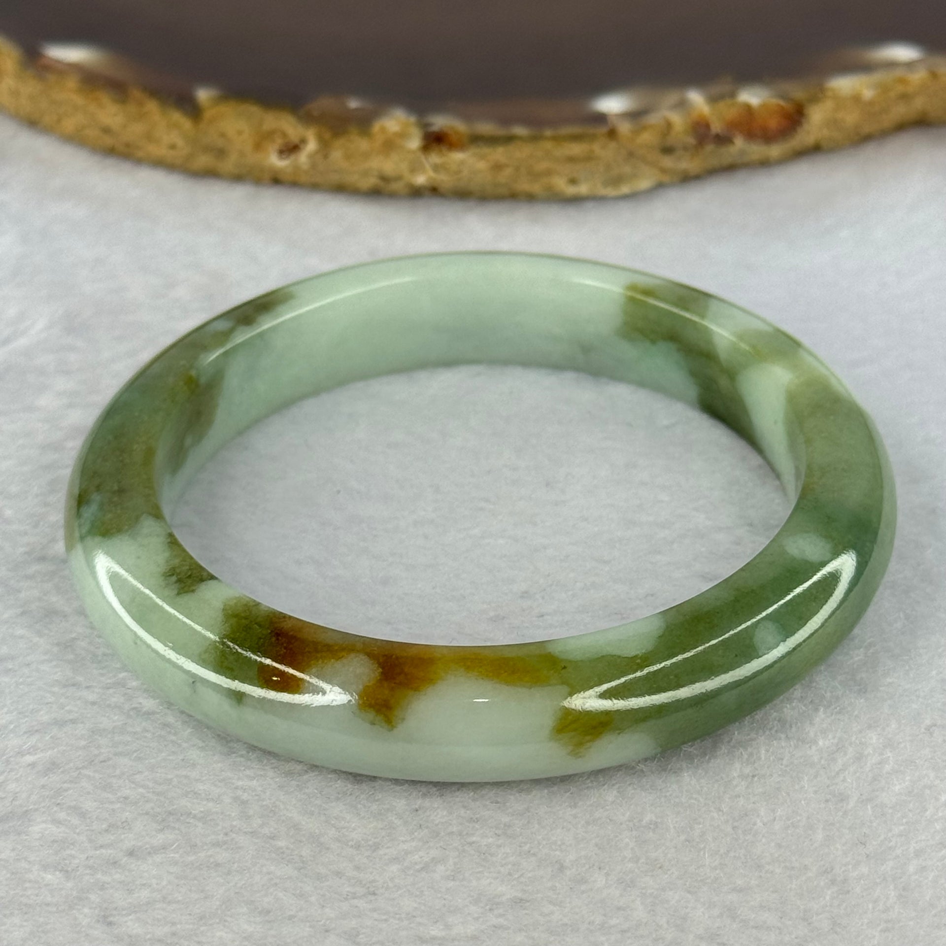 Type A Light Green and Moss Green and Brown Patches Jadeite Bangle 55.5mm 51.12g 10.6 by 9.0mm (Slight Internal Line) - Huangs Jadeite and Jewelry Pte Ltd