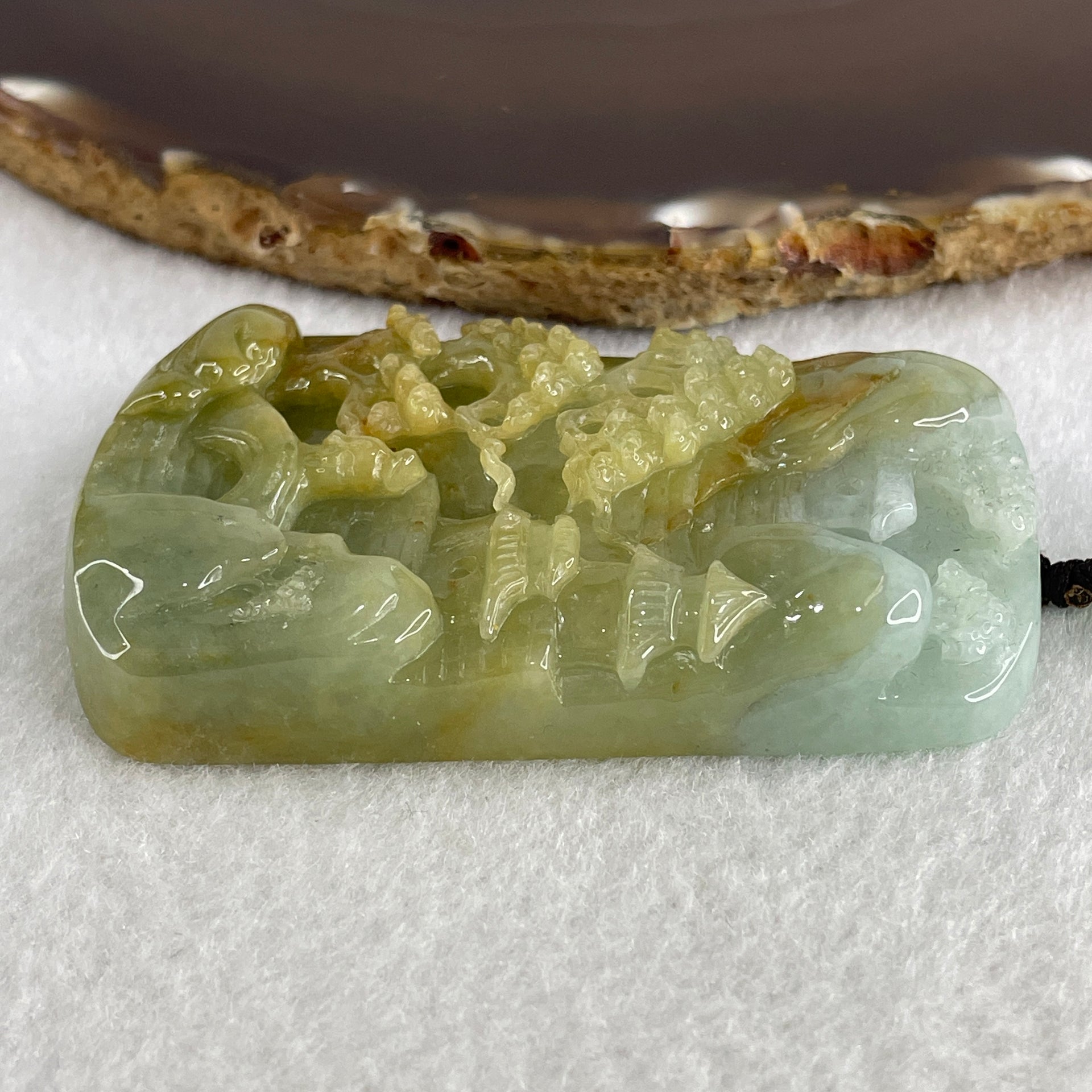 Natural Type A Yellowish Green with Sky Blue Jadeite Shan Shui with Gui Ren Benefactor Pendant 76.29g 67.4 by 43.0 by 12.0mm - Huangs Jadeite and Jewelry Pte Ltd