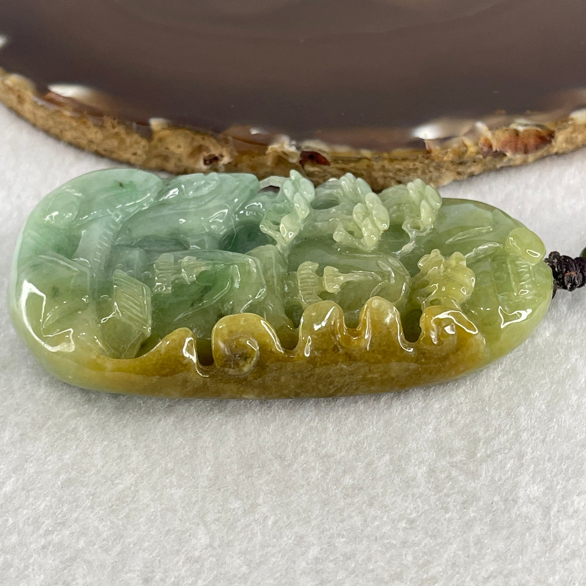 Natural Type A Green with Yellowish Jadeite Shan Shui with Gui Ren Pendant 127.68g 75.0 by 44.7 by 14.7mm - Huangs Jadeite and Jewelry Pte Ltd